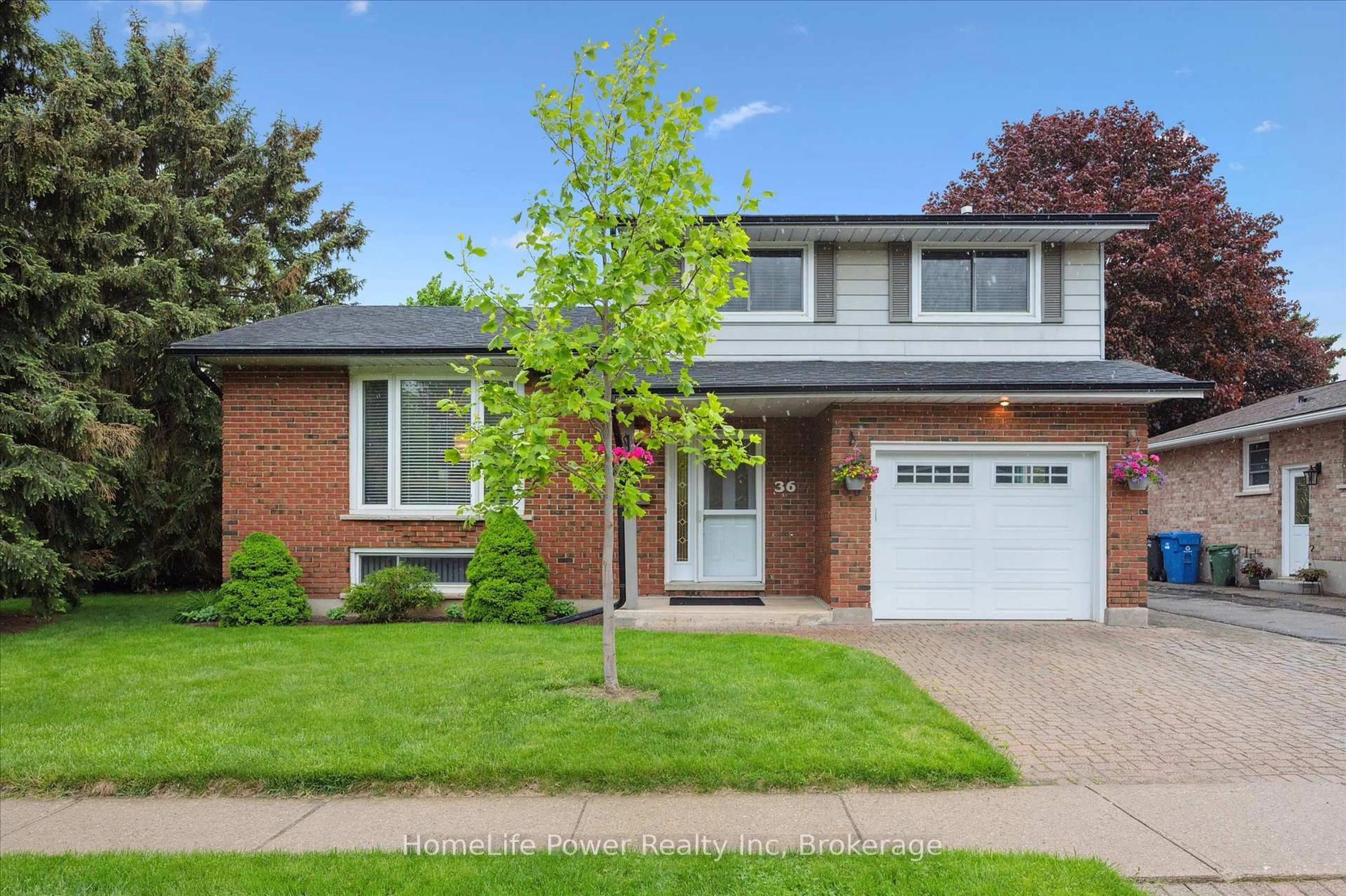 Home with brick exterior material, street for 36 Sanderson Dr, Guelph Ontario N1H 7B8