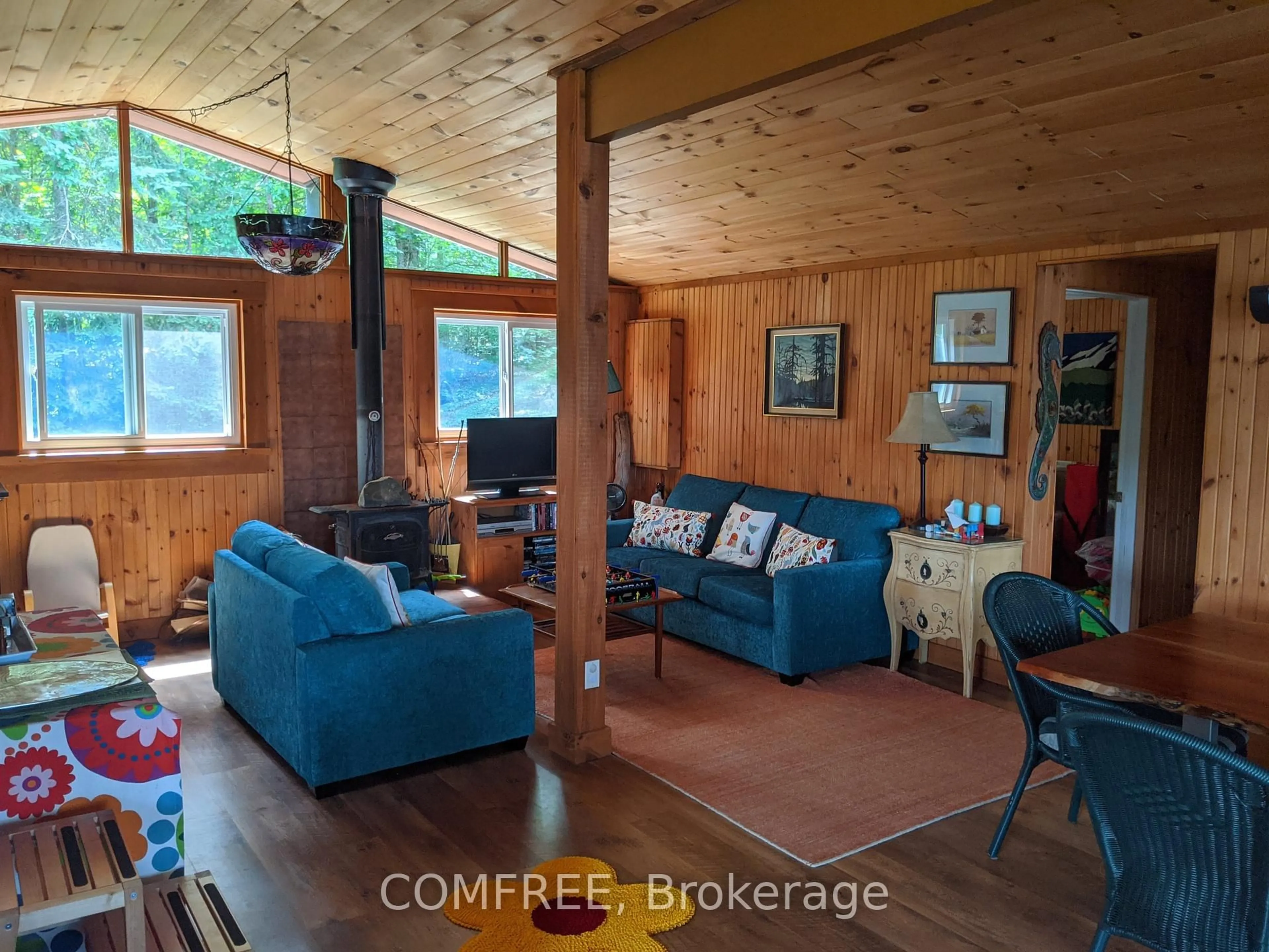 Living room with furniture, wood/laminate floor for 299 Sherwood Dr, Perry Ontario P0A 1R0