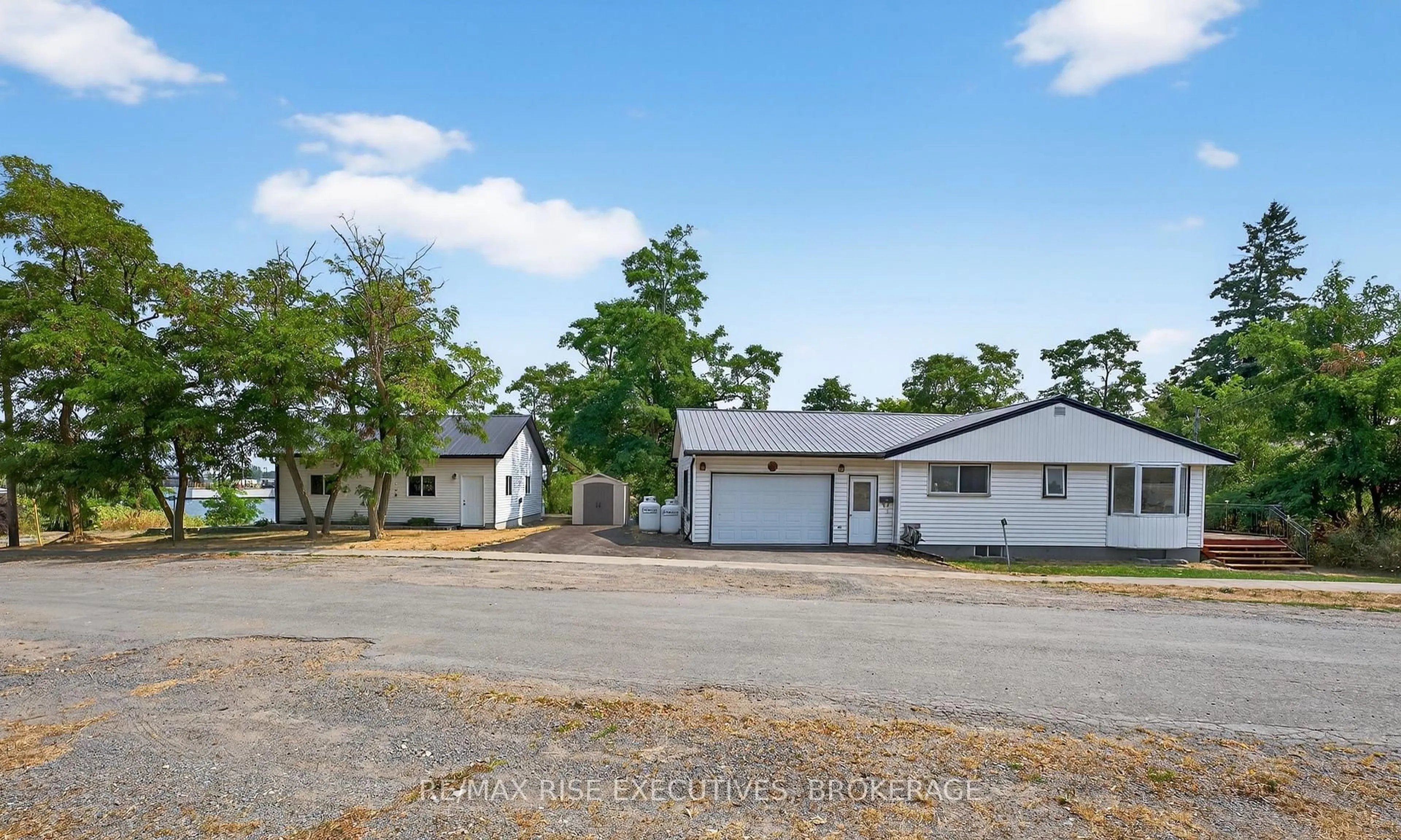 A pic from outside/outdoor area/front of a property/back of a property/a pic from drone, unknown for 14 Highway 95, Wolfe Island Ontario K0H 2Y0