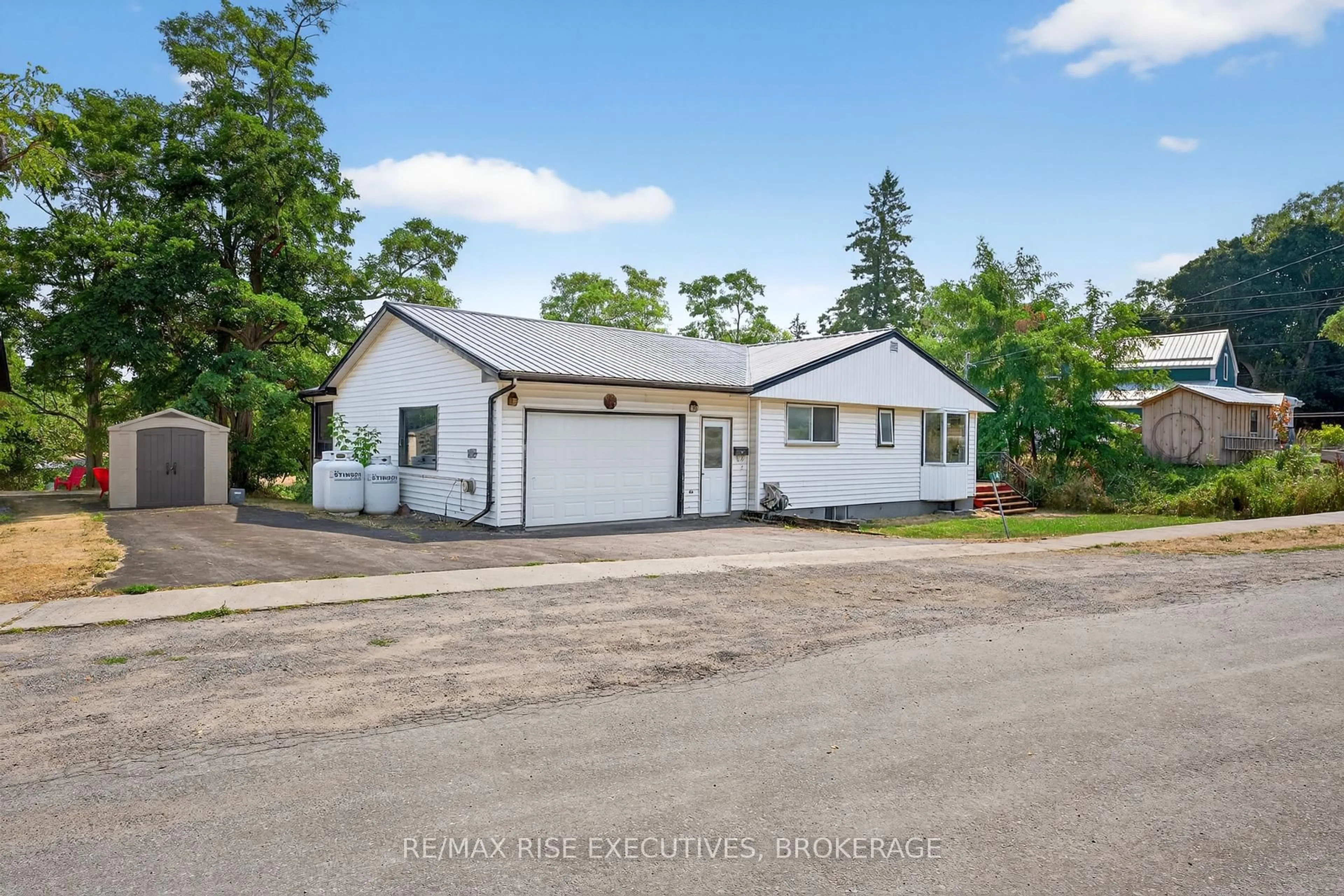 A pic from outside/outdoor area/front of a property/back of a property/a pic from drone, street for 14 Highway 95, Wolfe Island Ontario K0H 2Y0