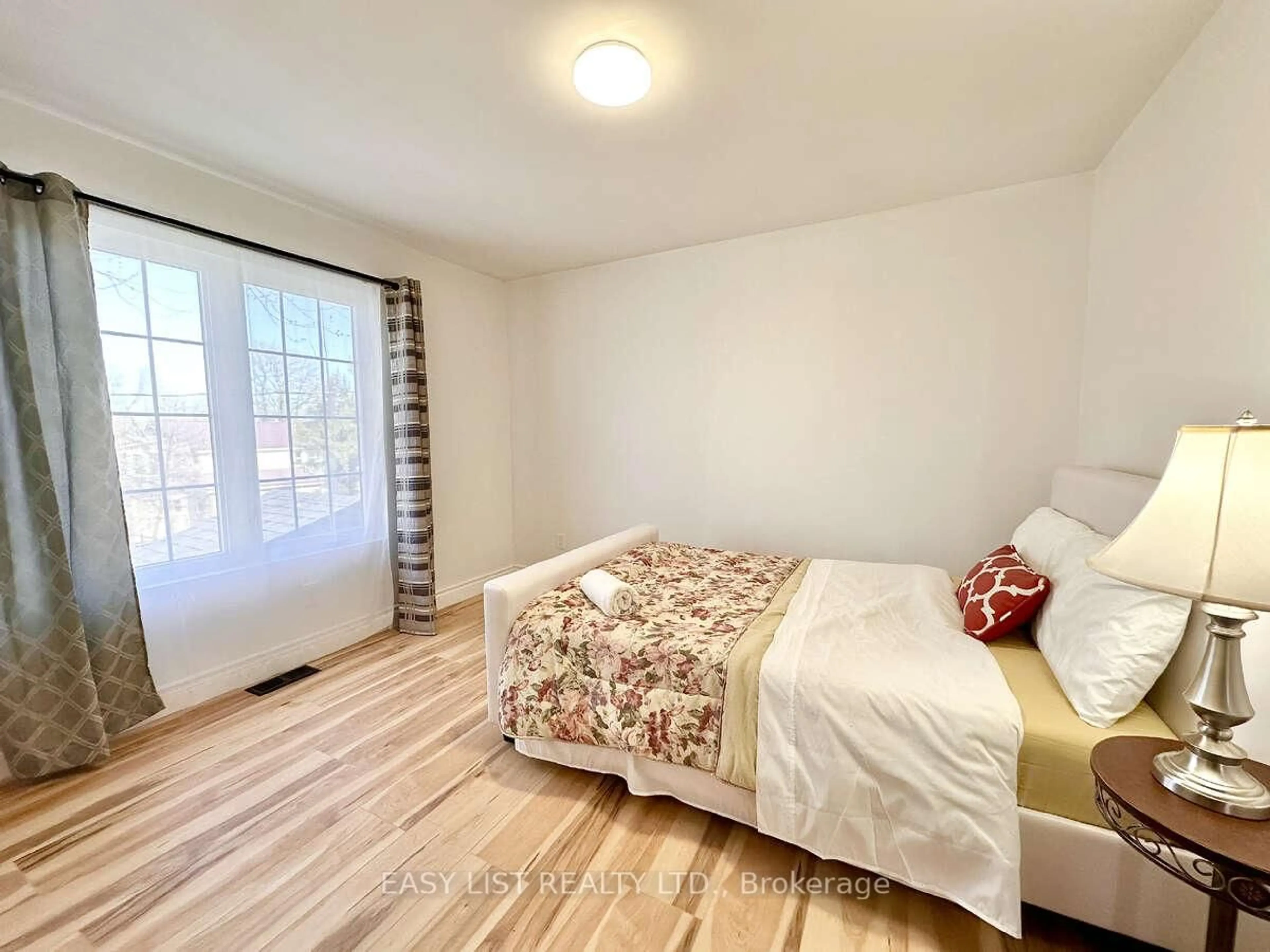 Bedroom with bed, wood/laminate floor for 664 King St, Port Colborne Ontario L3K 4H8
