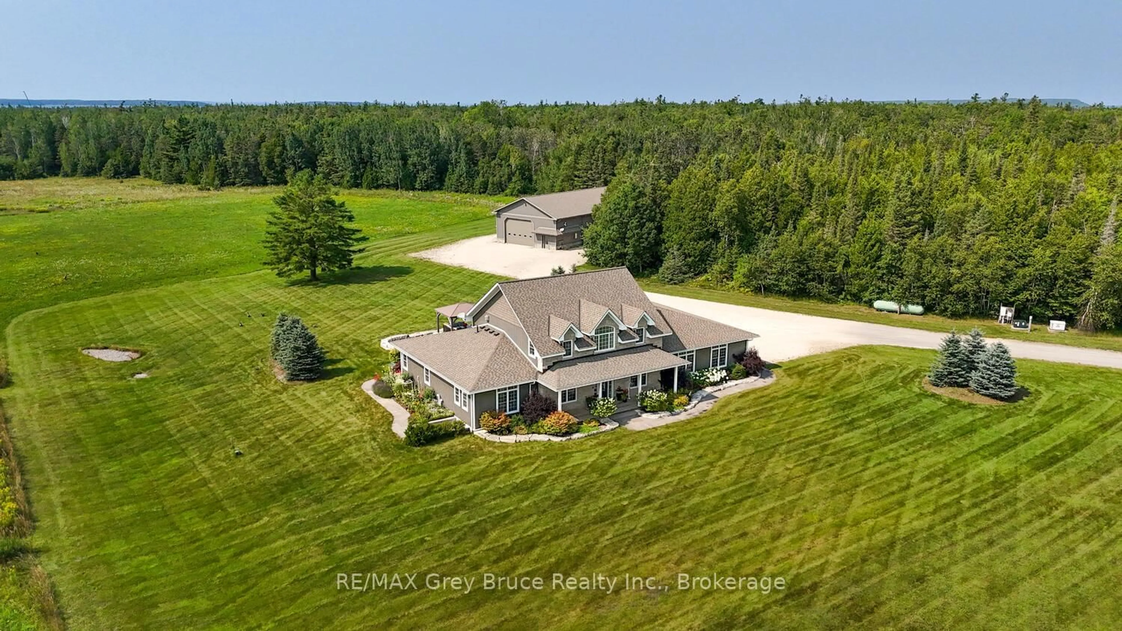 A pic from outside/outdoor area/front of a property/back of a property/a pic from drone, unknown for 33 Dunks Bay Rd, Northern Bruce Peninsula Ontario N0H 2R0
