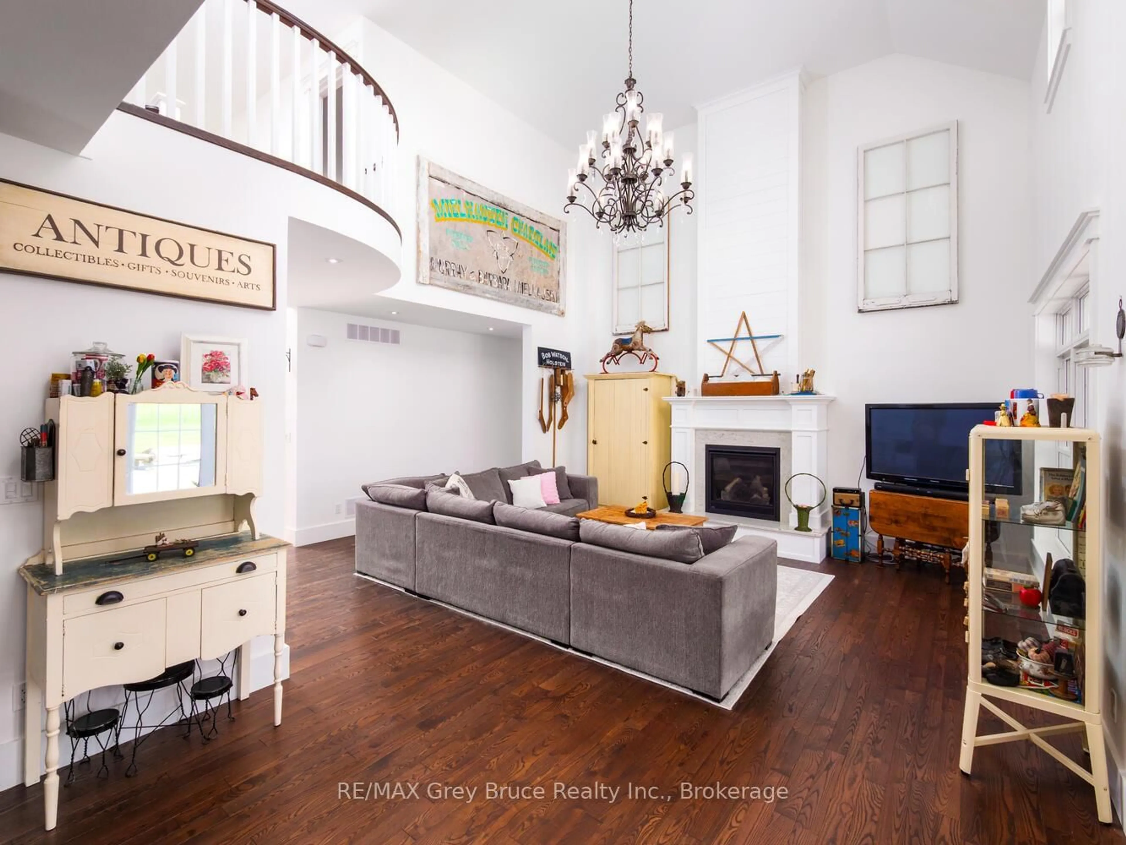 Living room with furniture, wood/laminate floor for 33 Dunks Bay Rd, Northern Bruce Peninsula Ontario N0H 2R0