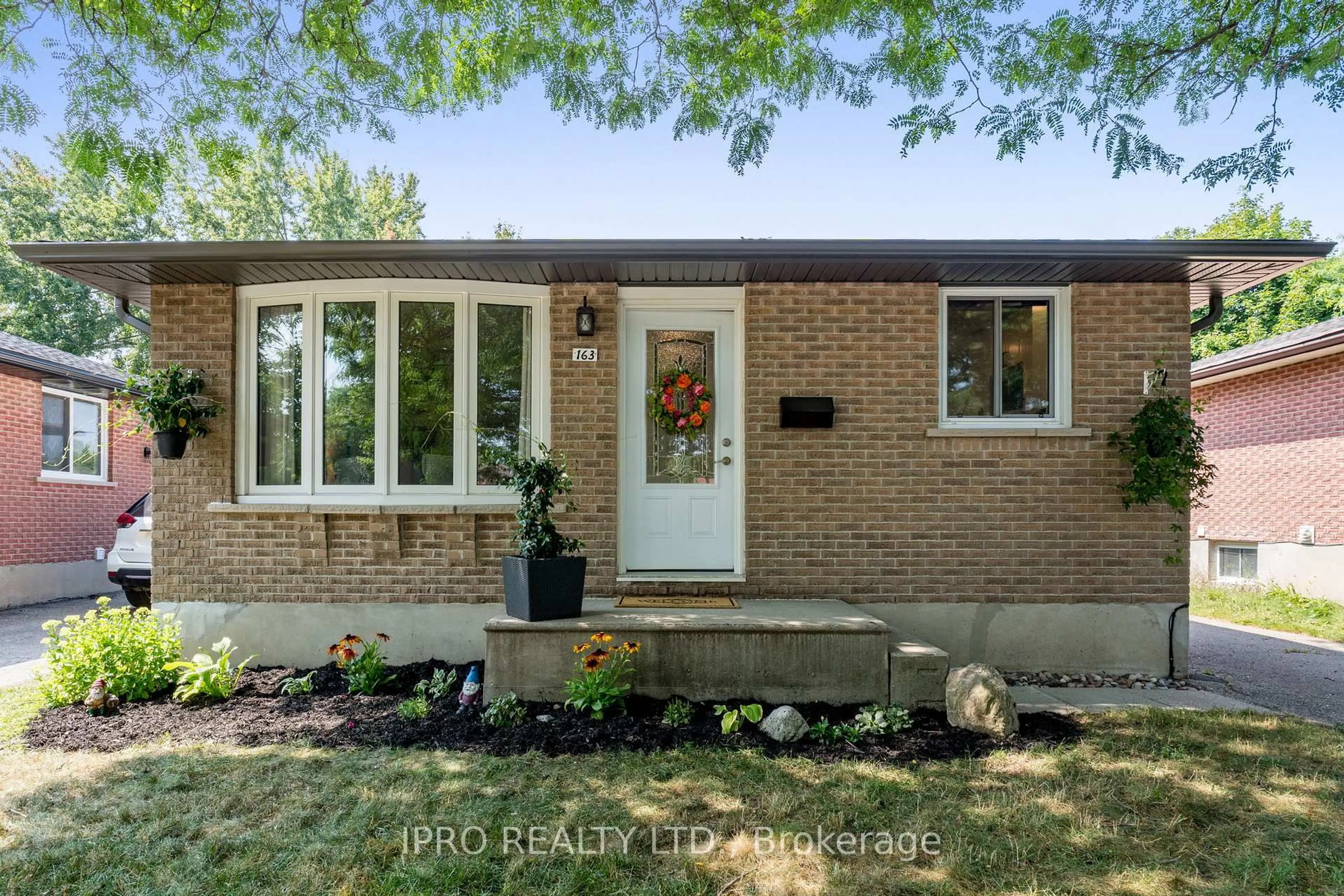 Home with brick exterior material, street for 163 Hadati Rd, Guelph Ontario N1E 6N3
