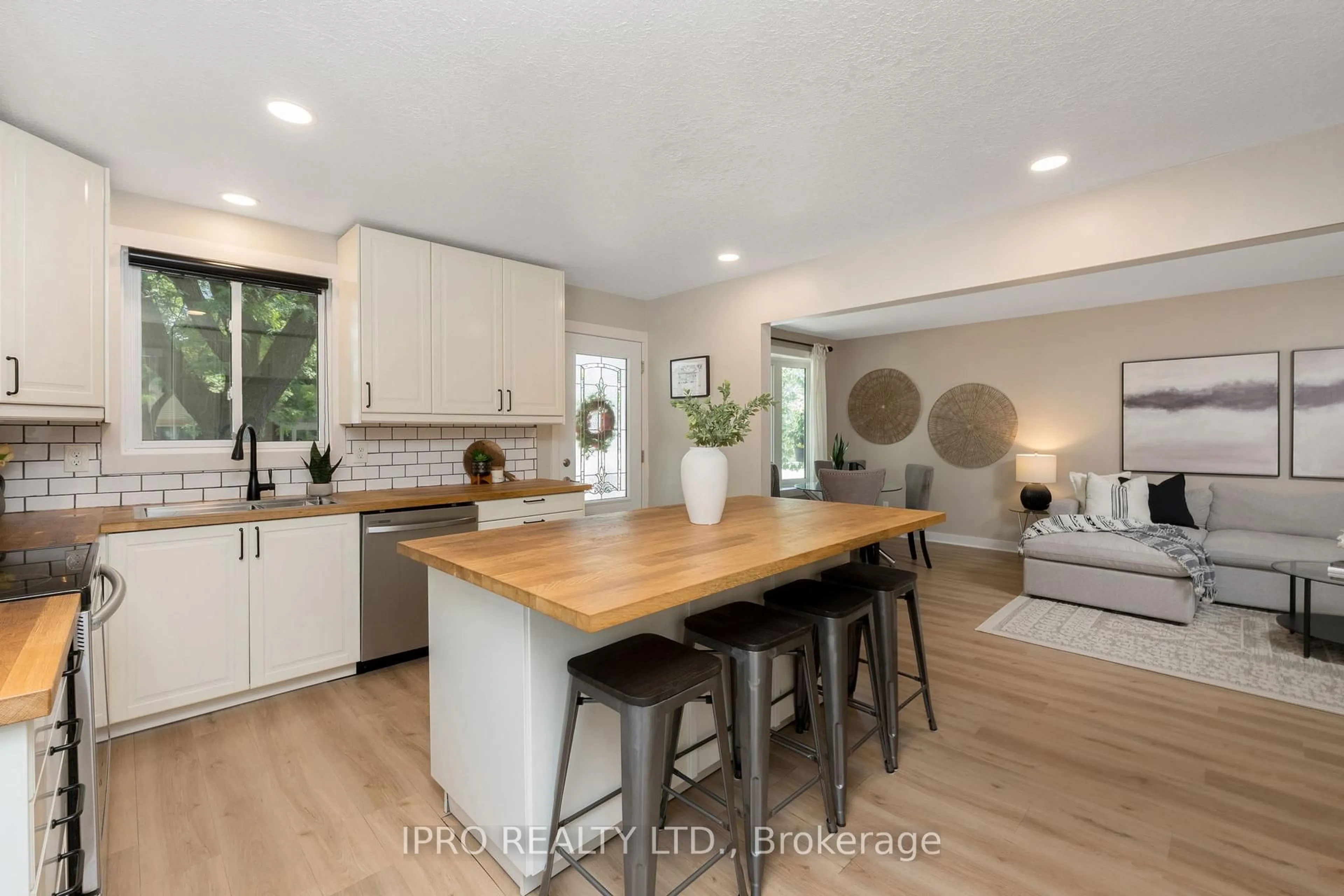Open concept kitchen, wood/laminate floor for 163 Hadati Rd, Guelph Ontario N1E 6N3