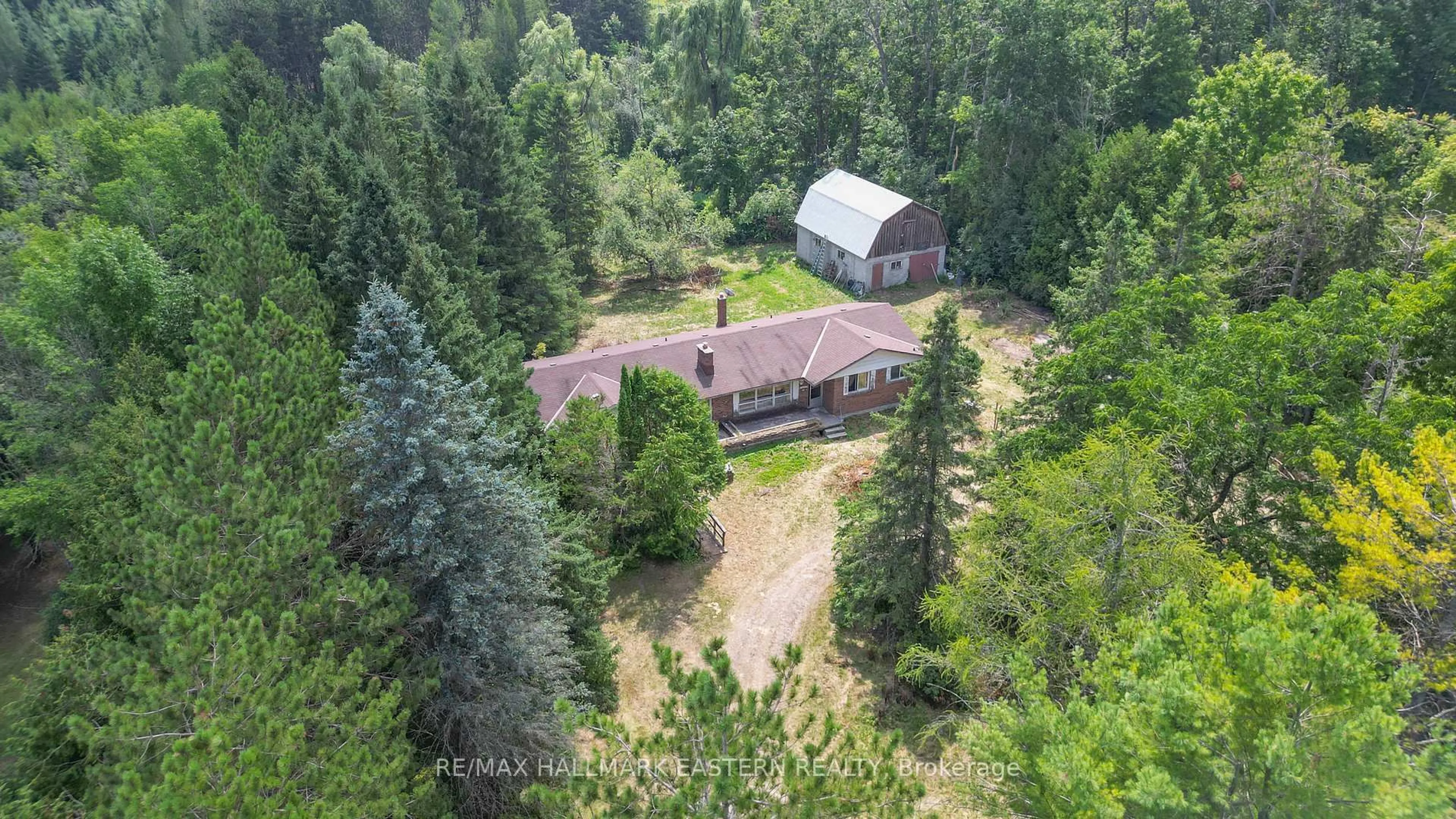 A pic from outside/outdoor area/front of a property/back of a property/a pic from drone, forest/trees view for 751 Ford Cres, Cavan Monaghan Ontario L0A 1C0