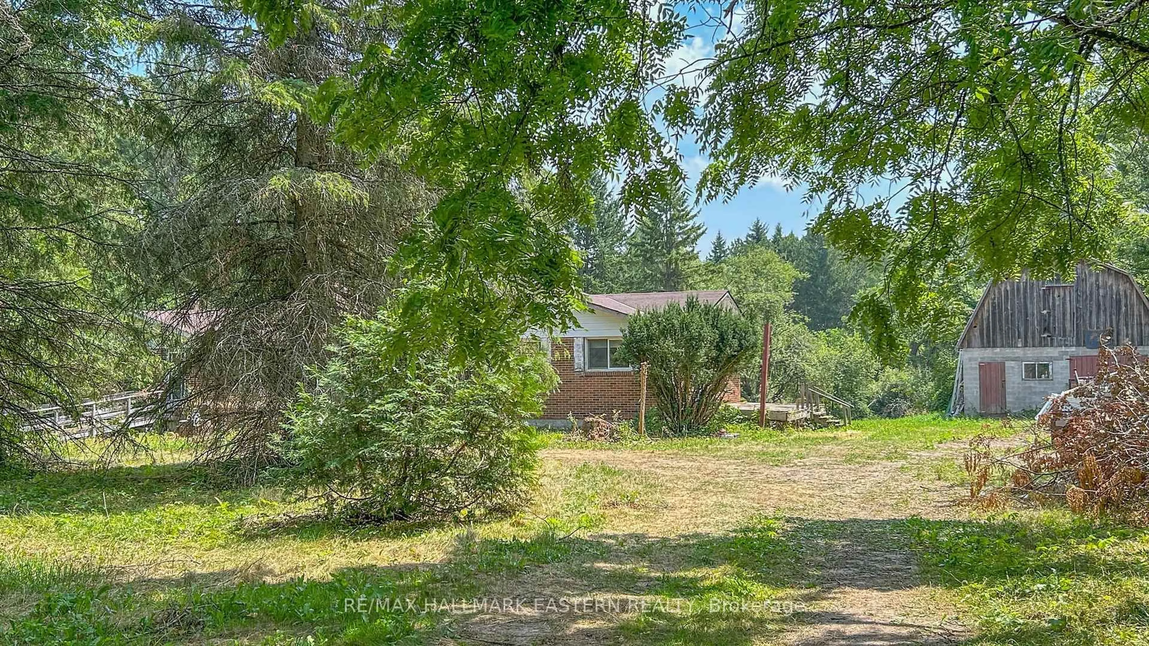 A pic from outside/outdoor area/front of a property/back of a property/a pic from drone, forest/trees view for 751 Ford Cres, Cavan Monaghan Ontario L0A 1C0