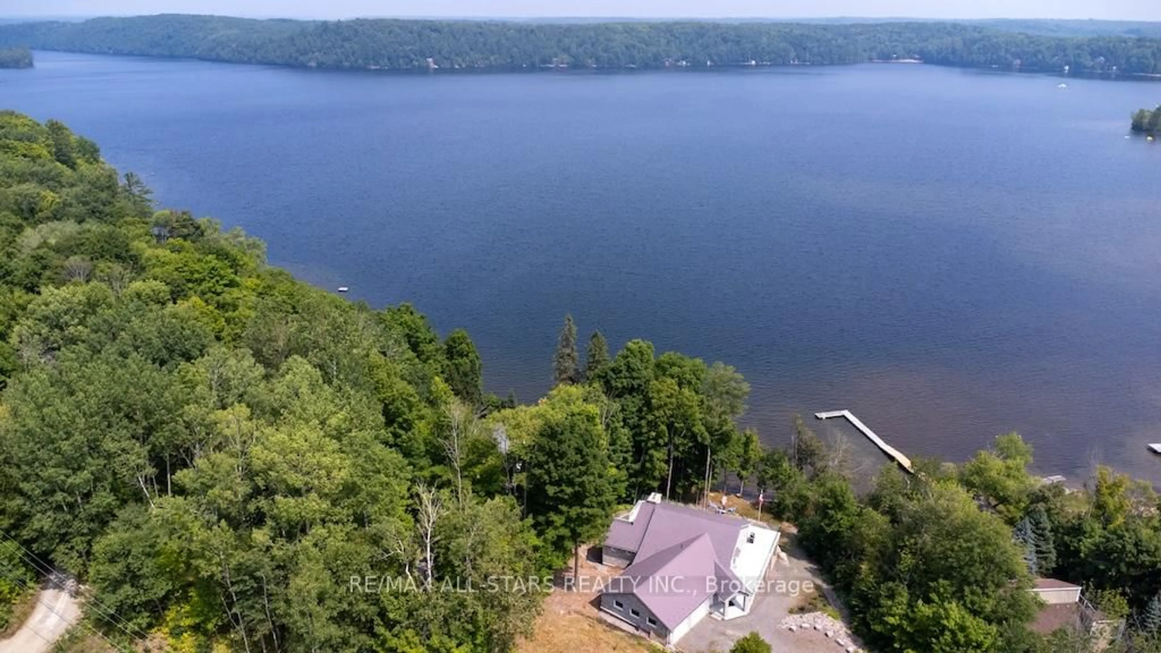A pic from outside/outdoor area/front of a property/back of a property/a pic from drone, water/lake/river/ocean view for 13540 Highway 35, Minden Hills Ontario K0M 2K0