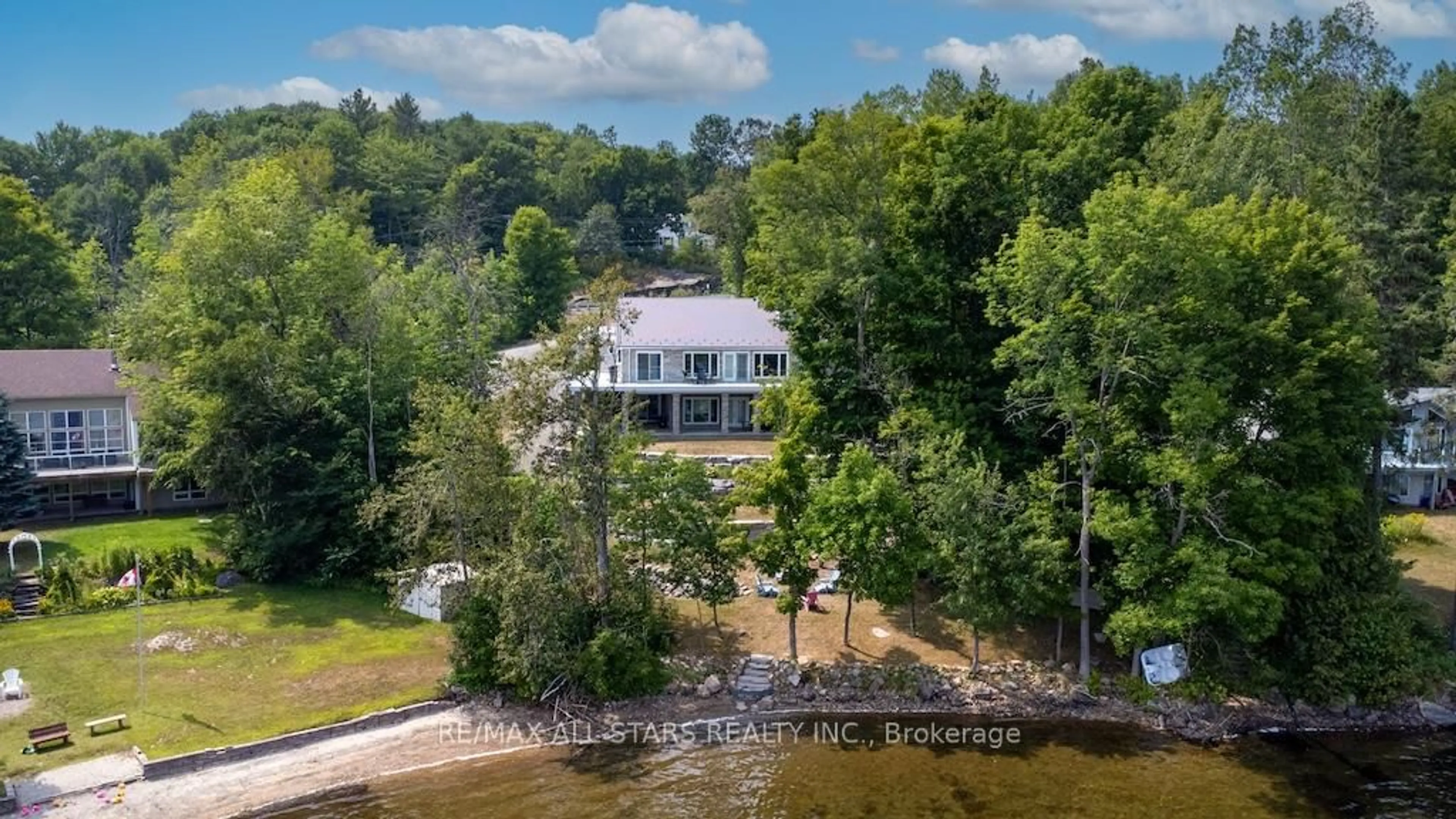 A pic from outside/outdoor area/front of a property/back of a property/a pic from drone, water/lake/river/ocean view for 13540 Highway 35, Minden Hills Ontario K0M 2K0