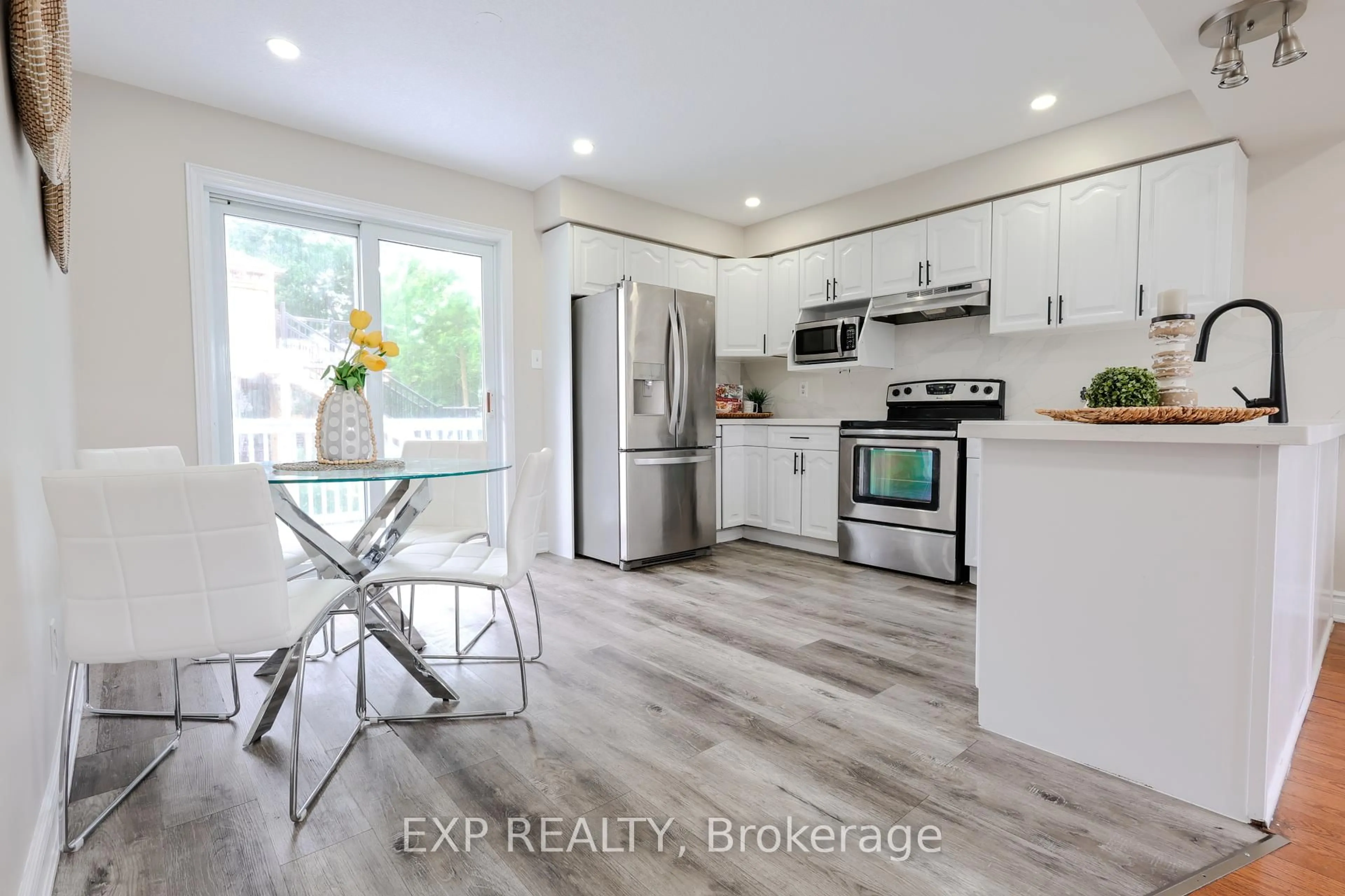 Open concept kitchen, wood/laminate floor for 1843 Old Mill Rd, Kitchener Ontario N2P 1E3