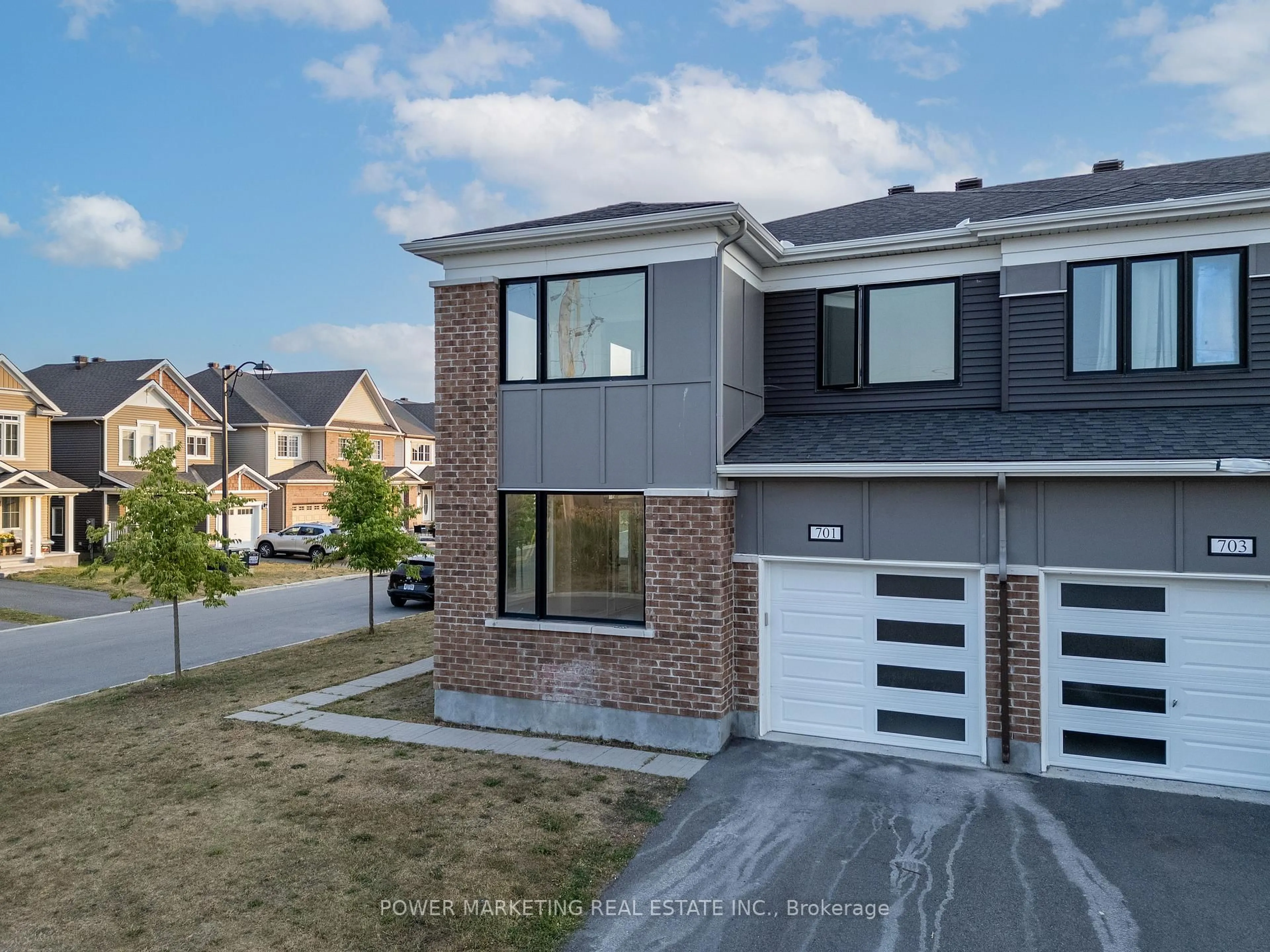 Home with brick exterior material, street for 701 Megrez Way, Ottawa Ontario K2J 6S9