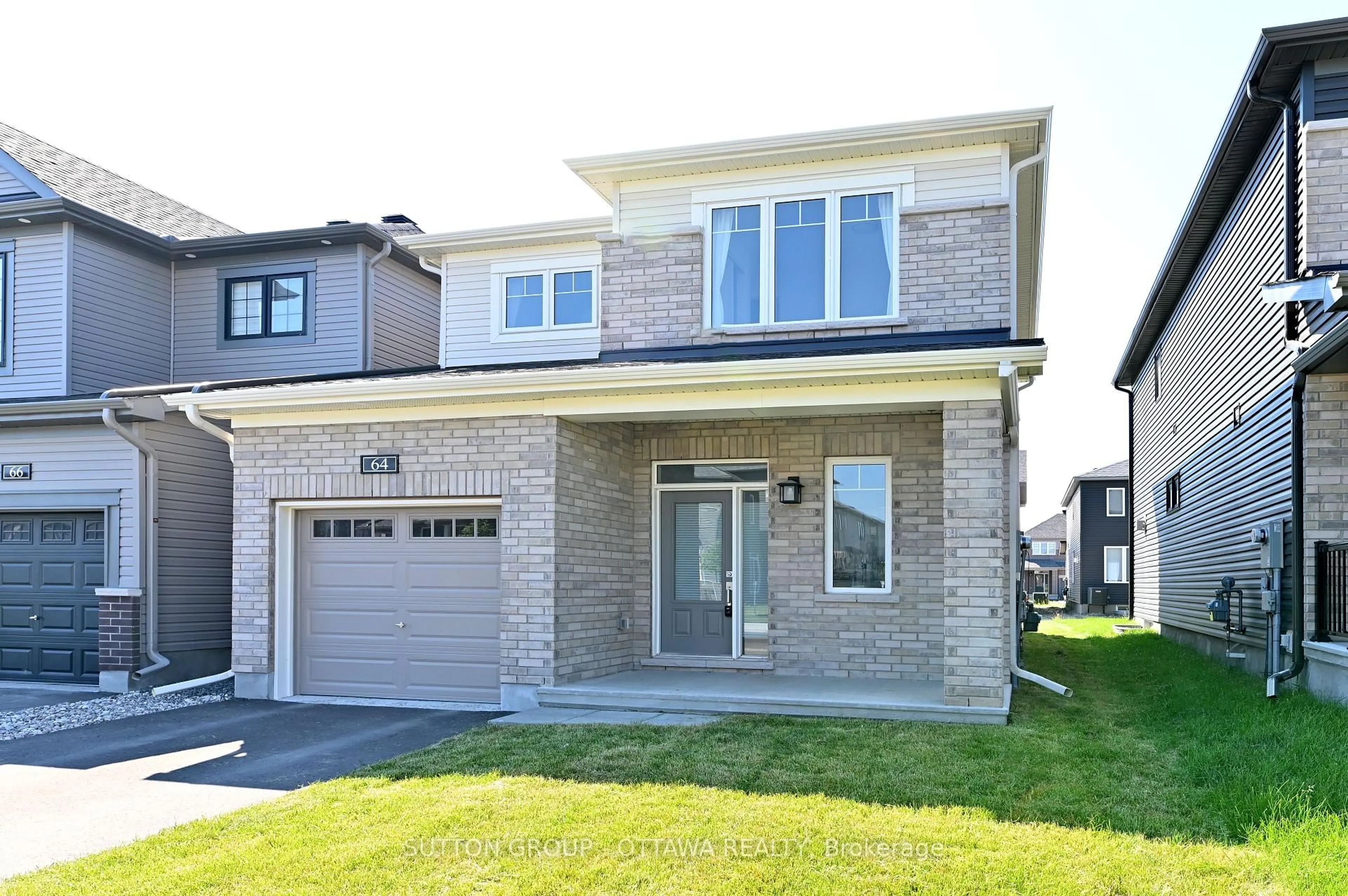 Home with brick exterior material, street for 64 Ralph Erfle Way, Ottawa Ontario K2J 6V5