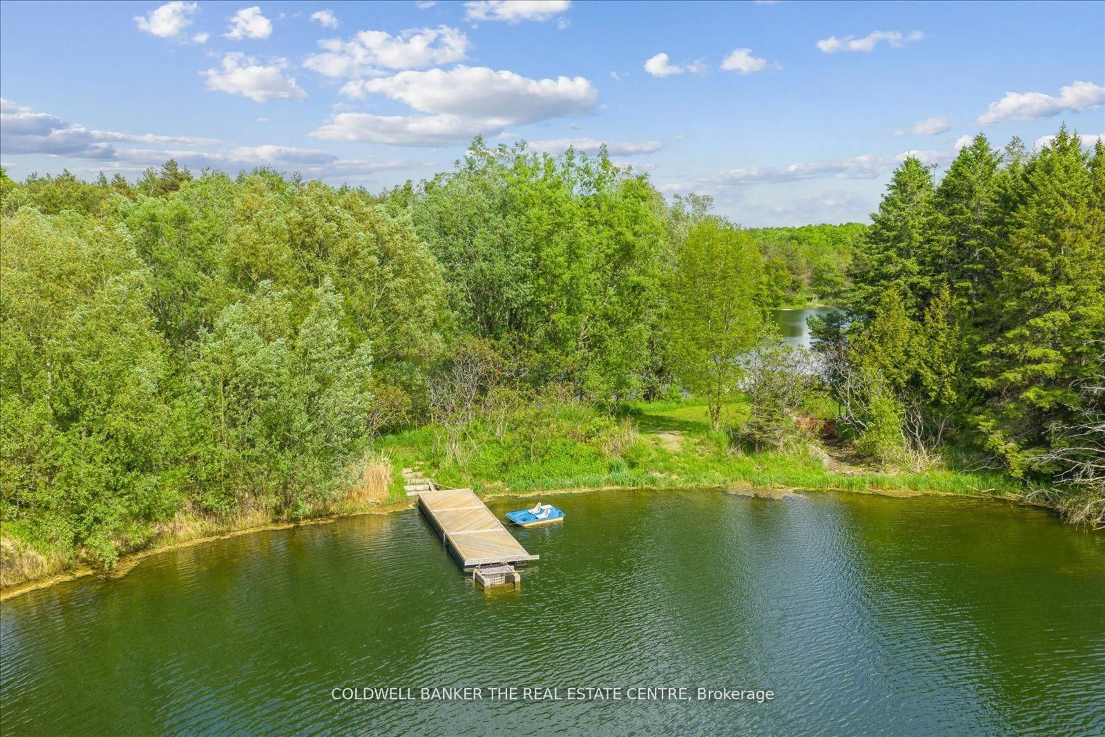 A pic from outside/outdoor area/front of a property/back of a property/a pic from drone, water/lake/river/ocean view for 798213 3rd Line, Mulmur Ontario L9V 0H7