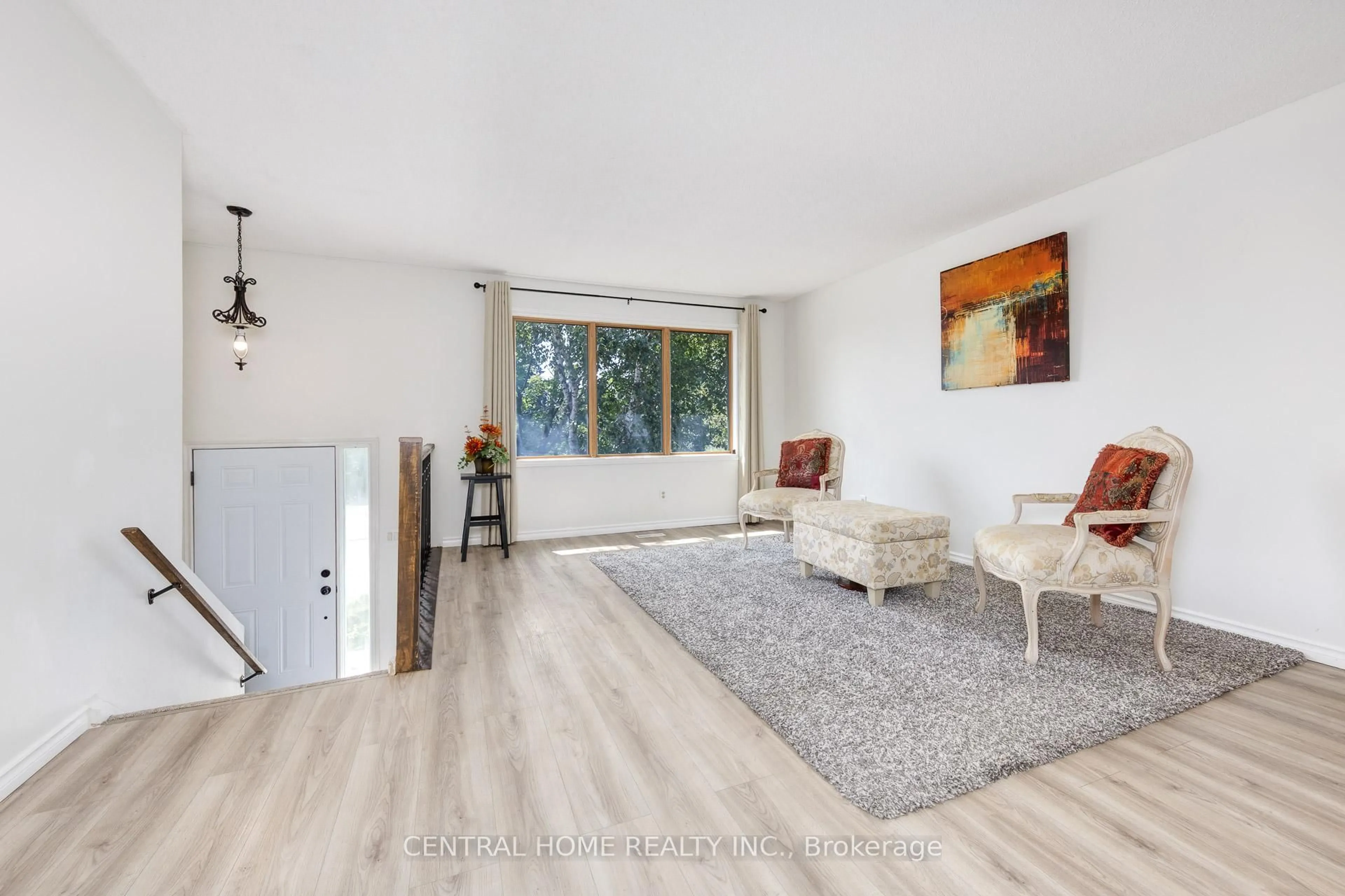 Living room with furniture, wood/laminate floor for 92 Pinemeadow Cres, Waterloo Ontario N2T 1A7
