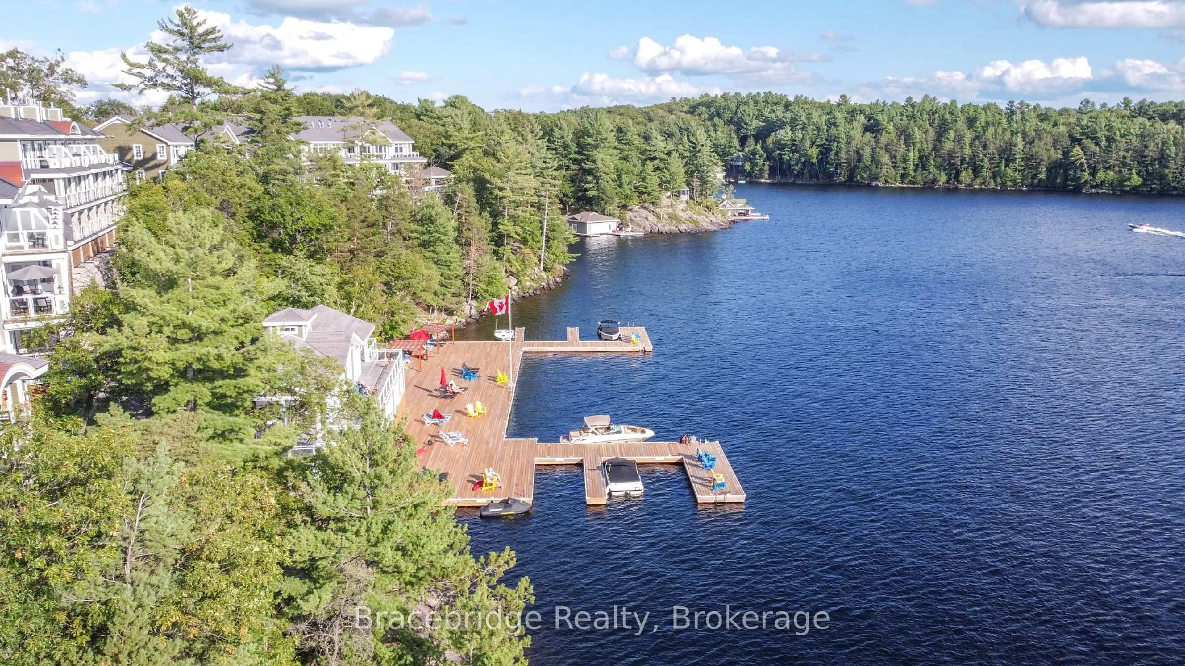 A pic from outside/outdoor area/front of a property/back of a property/a pic from drone, water/lake/river/ocean view for 1869 Muskoka 118 Rd #A103-D1, Muskoka Lakes Ontario P1L 1W8