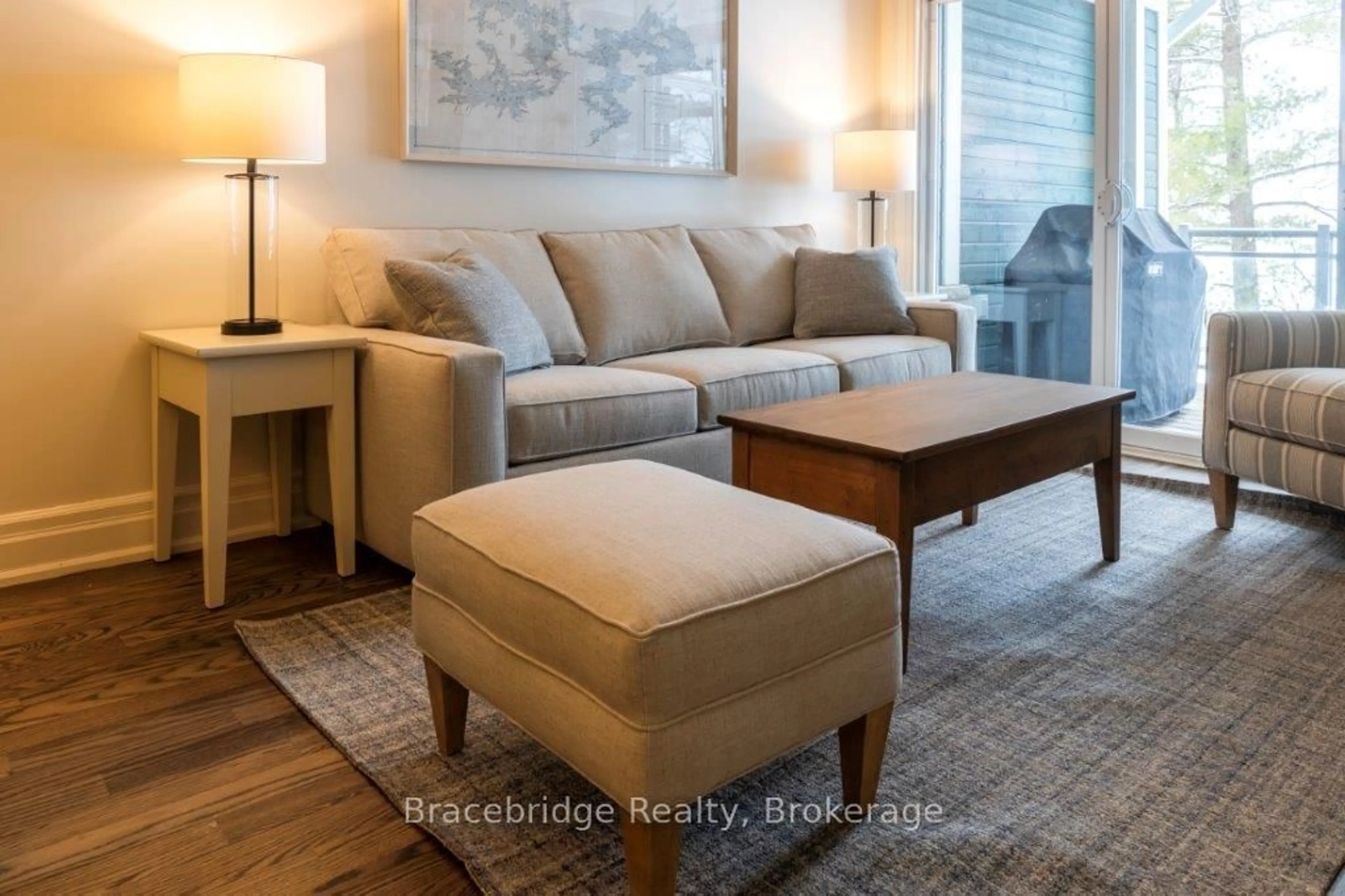 Living room with furniture, wood/laminate floor for 1869 Muskoka 118 Rd #A103-D1, Muskoka Lakes Ontario P1L 1W8