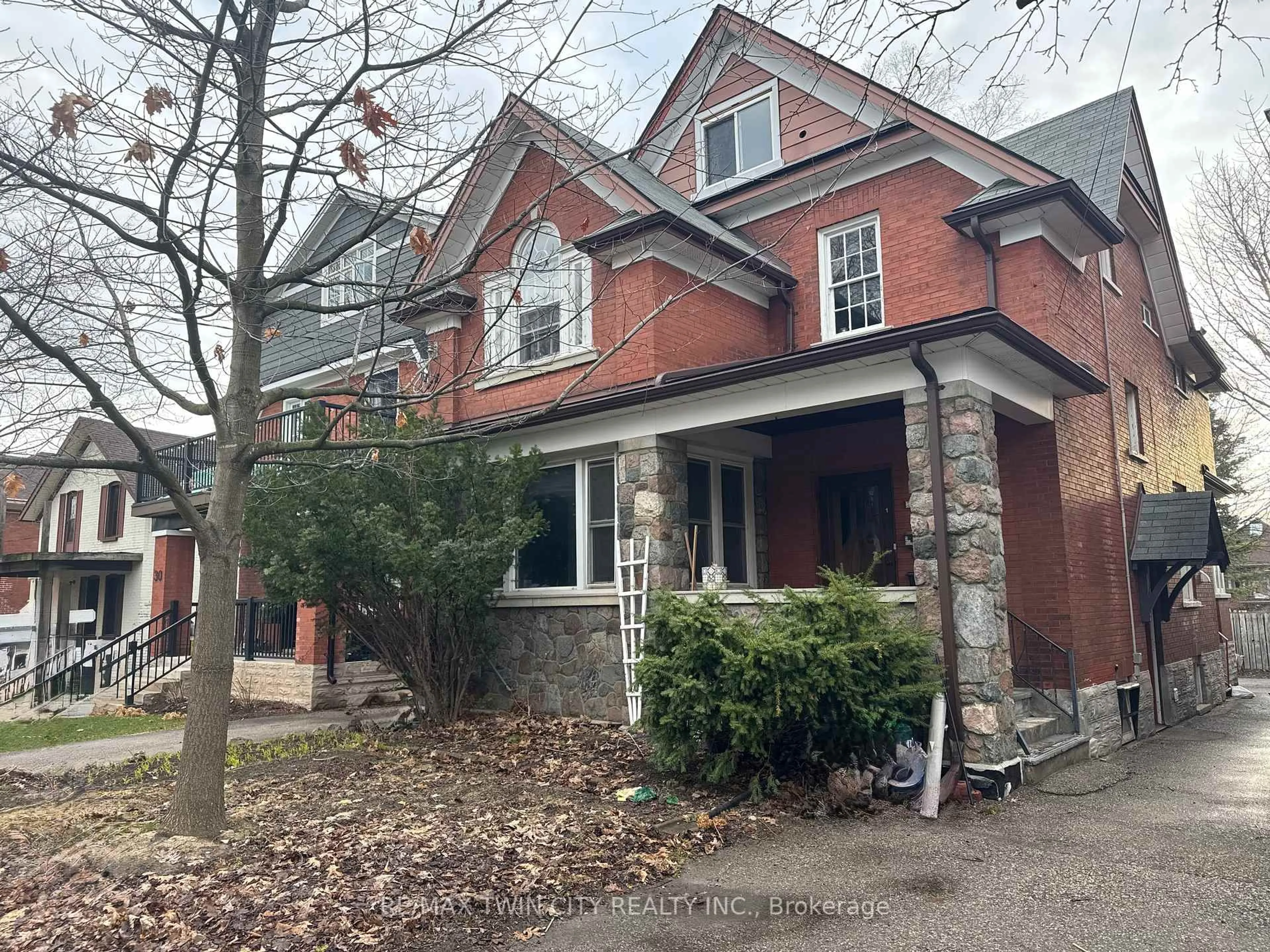 Home with brick exterior material, street for 32 Simeon St, Kitchener Ontario N2H 1S1
