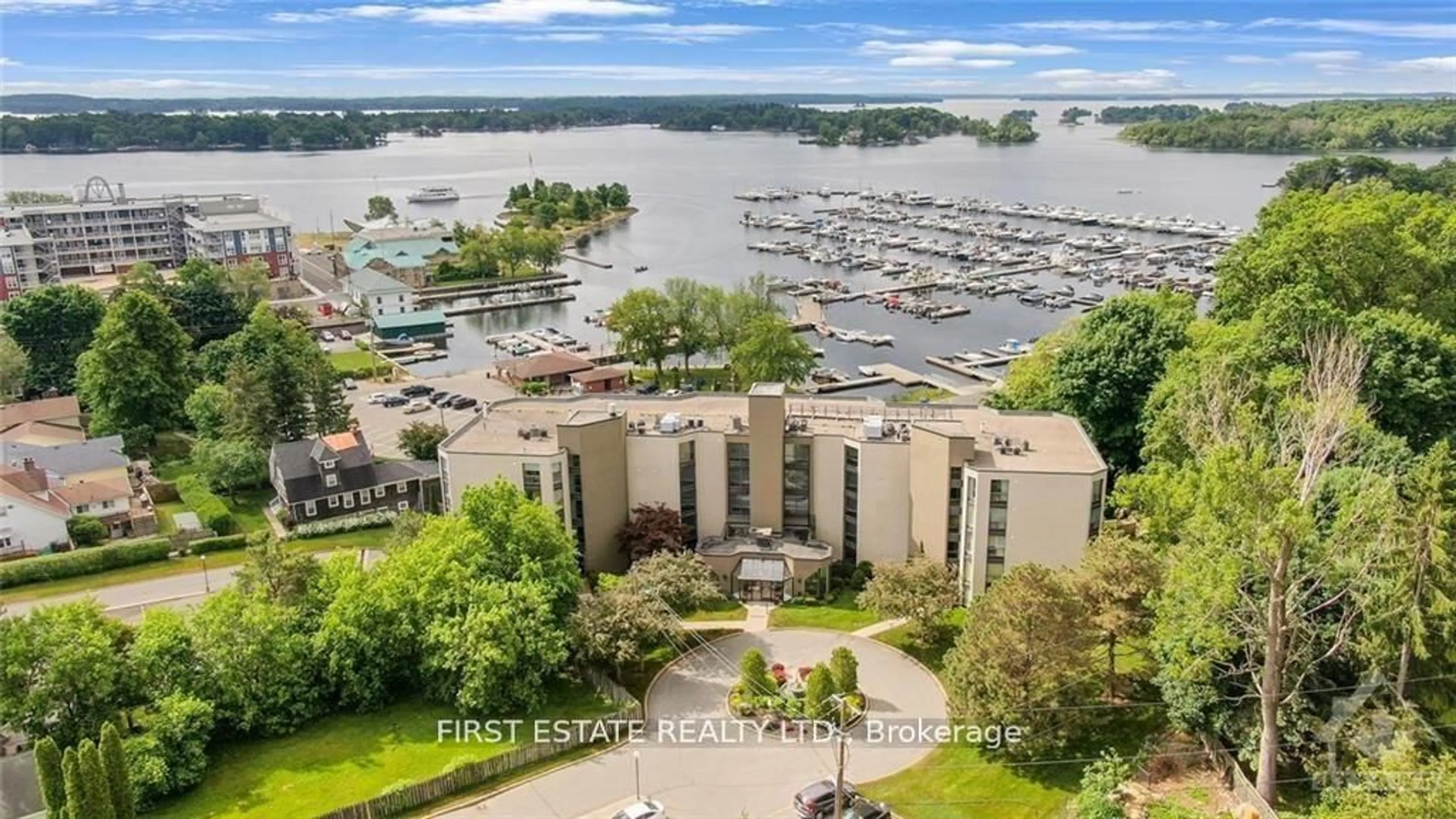 A pic from outside/outdoor area/front of a property/back of a property/a pic from drone, water/lake/river/ocean view for 50 MARKET St #203, Gananoque Ontario K7G 2M3
