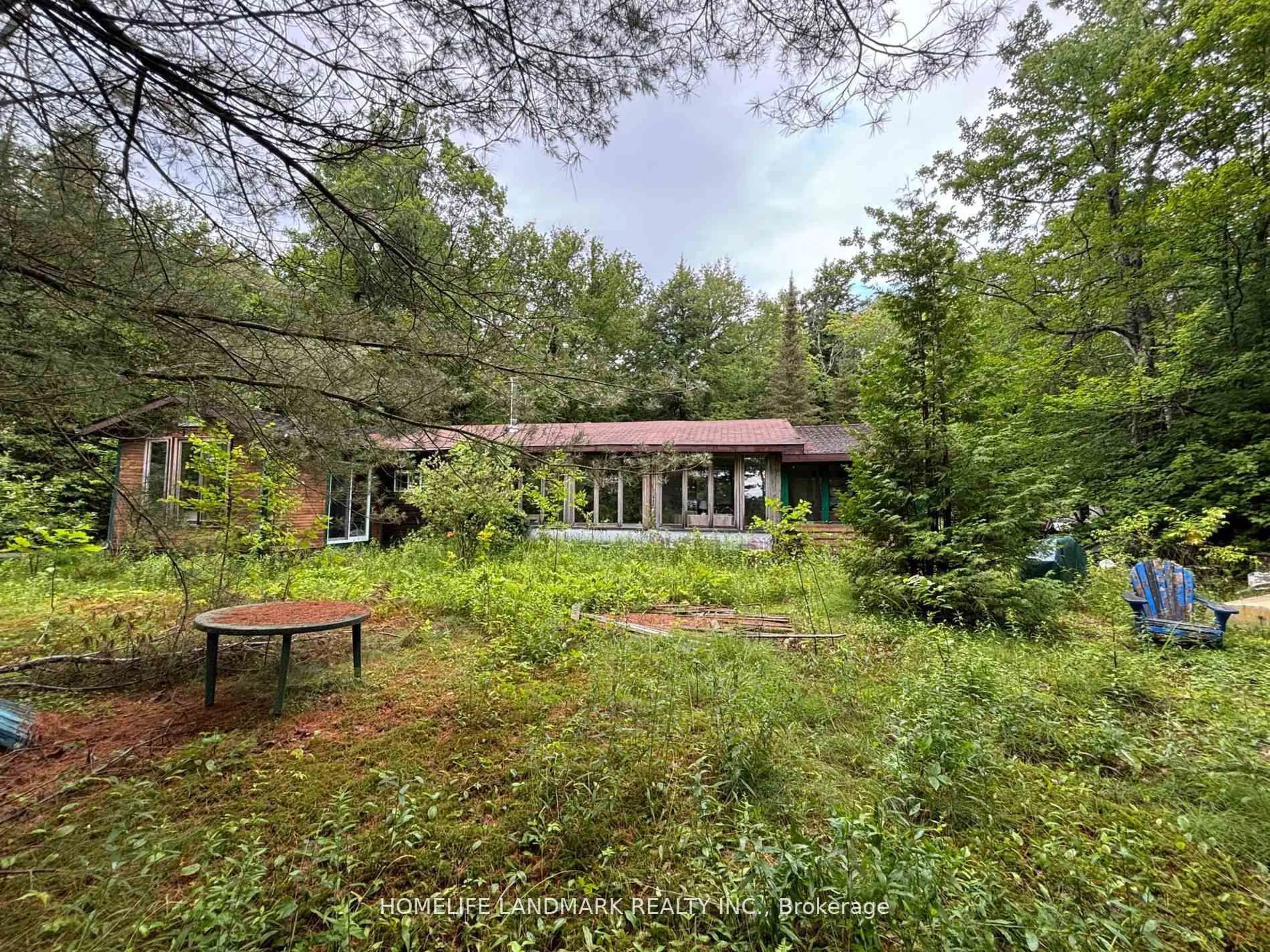 A pic from outside/outdoor area/front of a property/back of a property/a pic from drone, forest/trees view for 1663 Mississaugi Bay Rd, Huron Shores Ontario P0R 1H0
