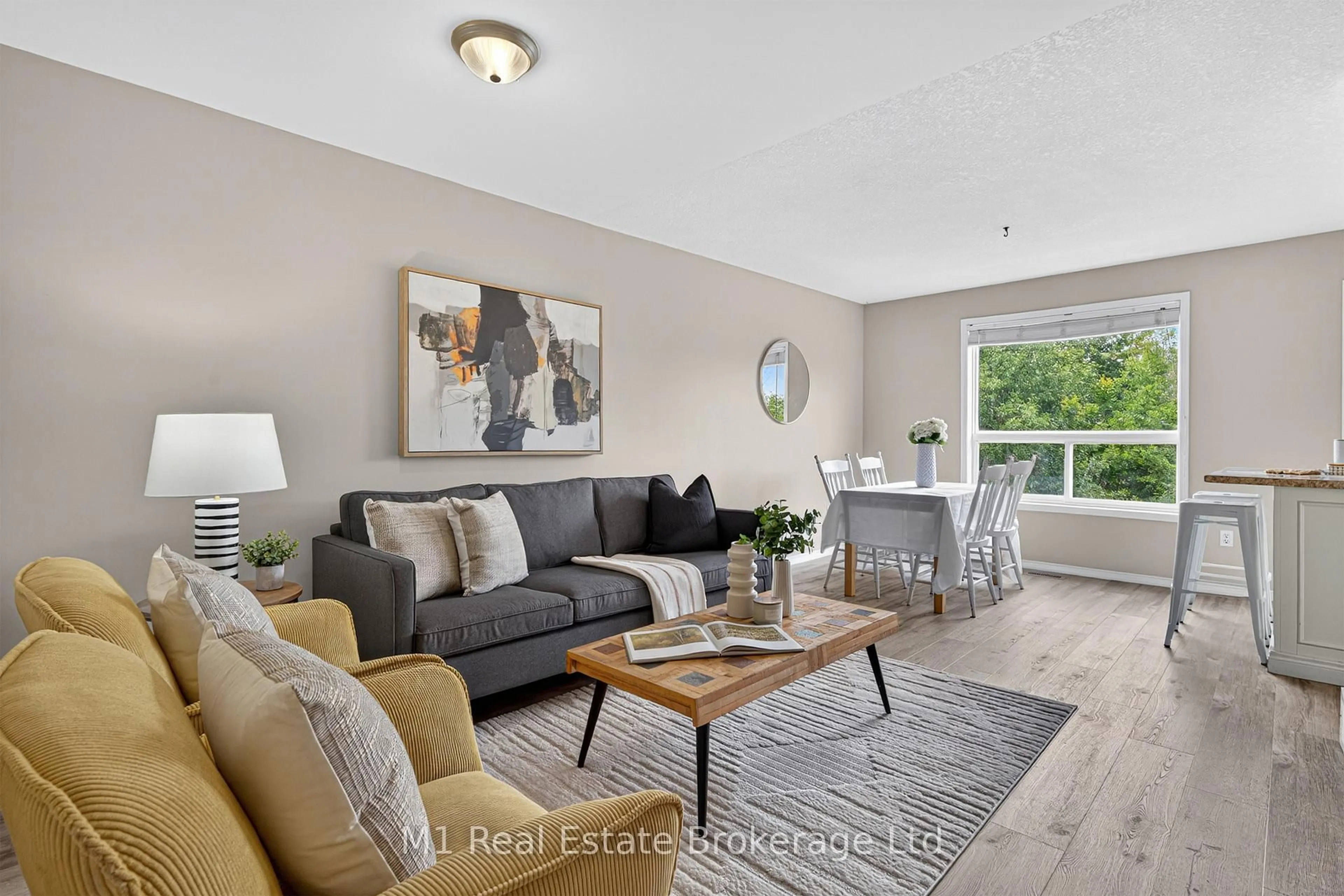 Living room with furniture, wood/laminate floor for 112 Chesterton Lane, Guelph Ontario N1E 7B8