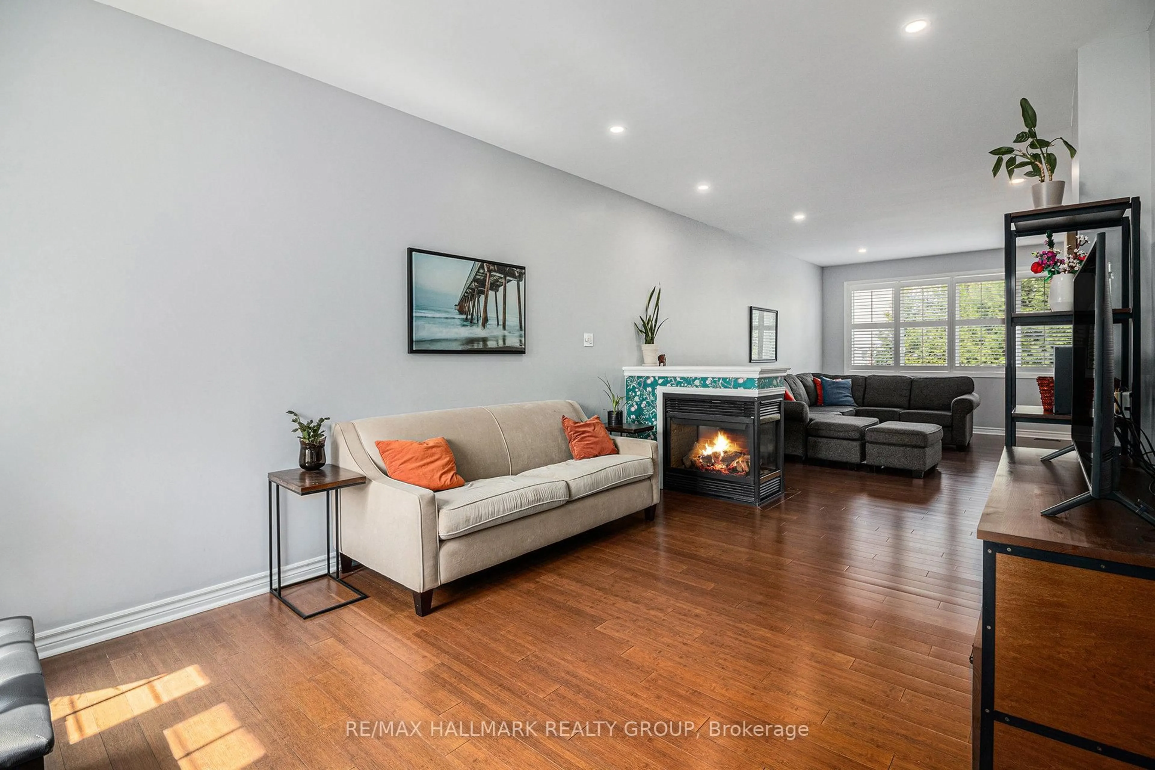 Living room with furniture, wood/laminate floor for 1565 Winterport Way, Orleans Ontario K4A 4B9