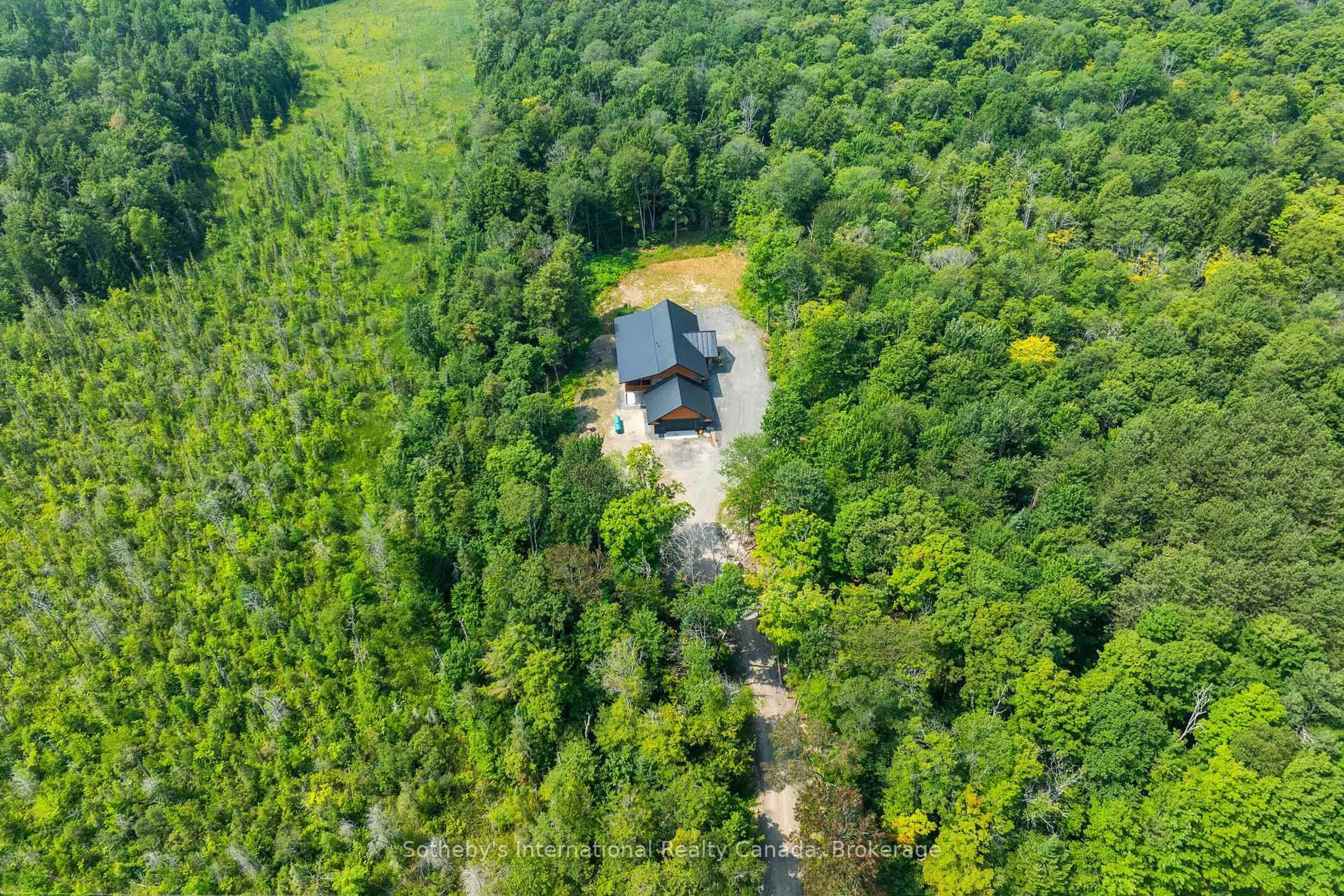 A pic from outside/outdoor area/front of a property/back of a property/a pic from drone, forest/trees view for 2749 Brunel Rd, Huntsville Ontario P1H 2J3