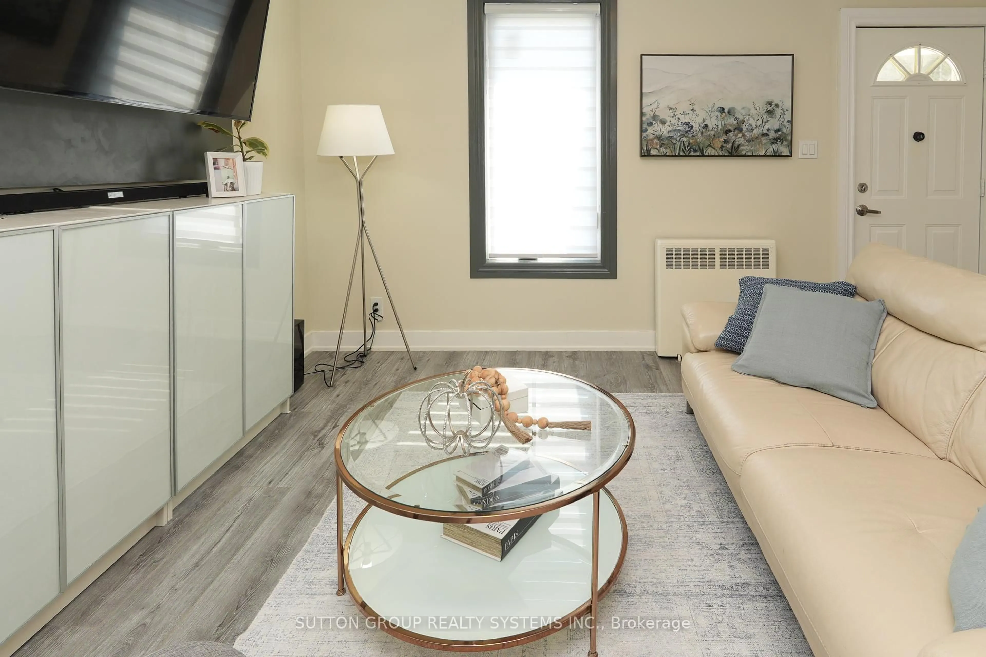 Living room with furniture, wood/laminate floor for 39 Norfolk Ave, Cambridge Ontario N1R 3T7
