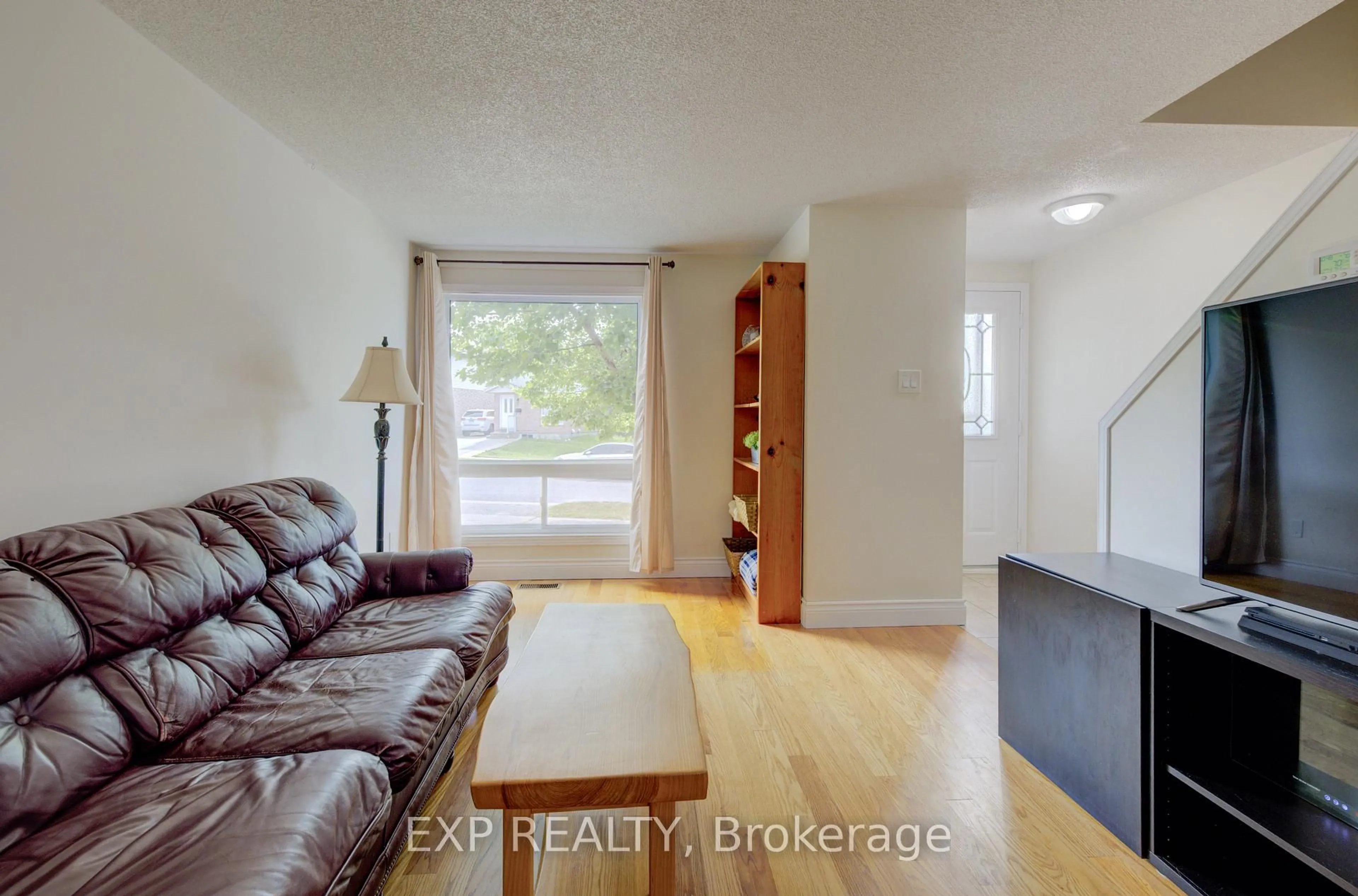 Living room with furniture, wood/laminate floor for 4 Troy Cres, Guelph Ontario N1E 6W7