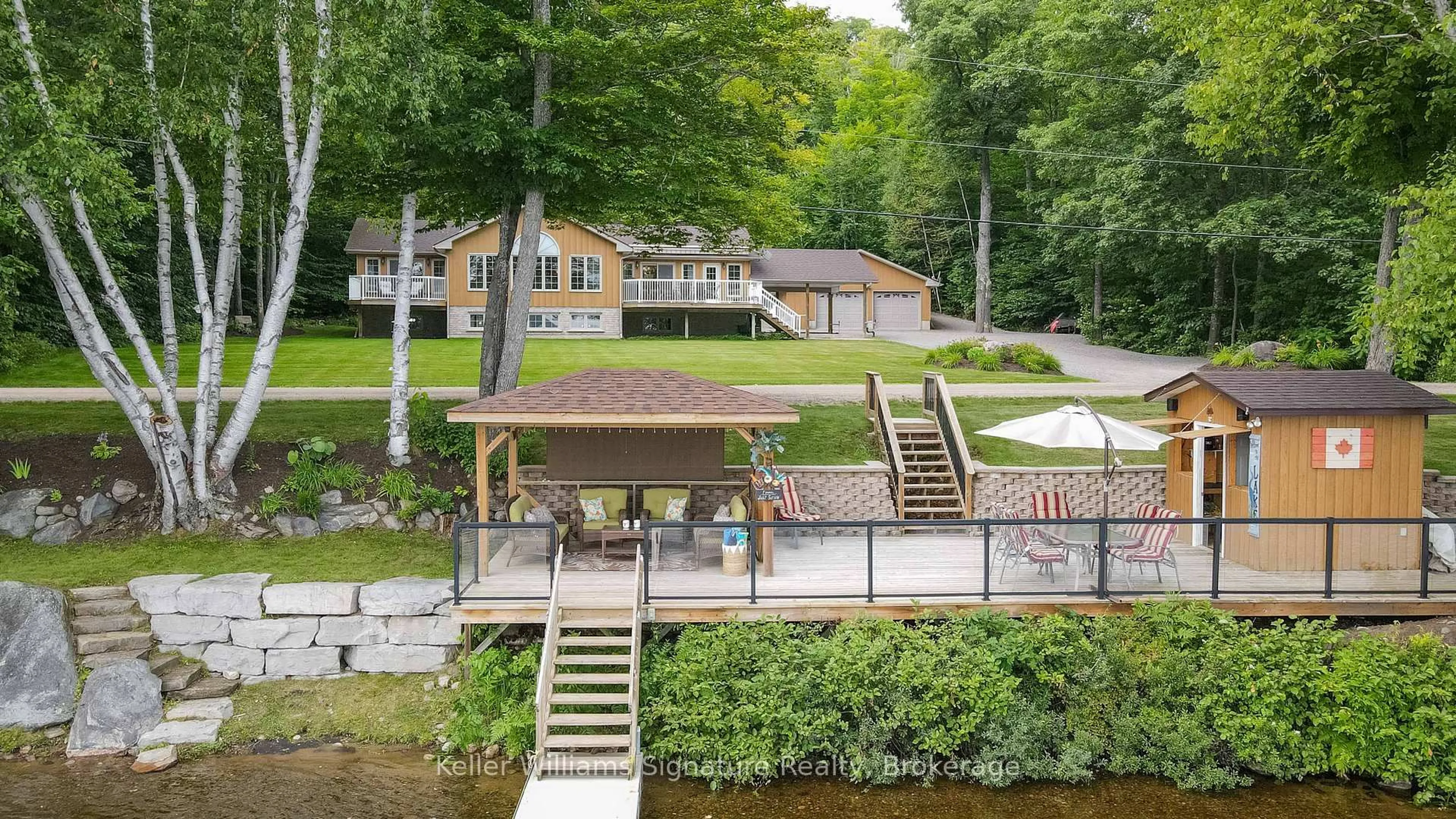 A pic from outside/outdoor area/front of a property/back of a property/a pic from drone, water/lake/river/ocean view for 165 LAKESHORE Dr, Combermere Ontario K0J 1L0