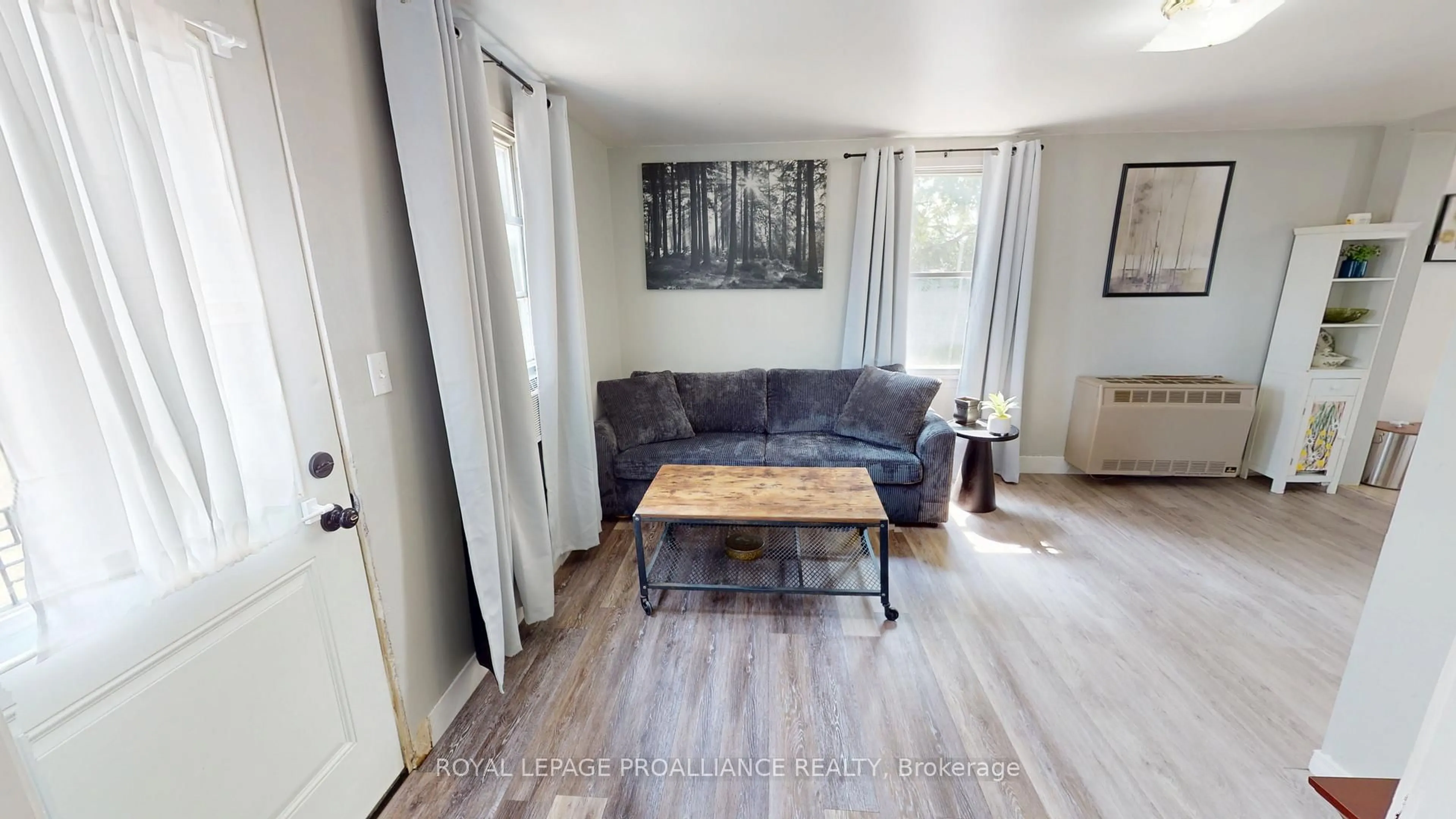 Living room with furniture, wood/laminate floor for 97 Aikins Rd, Belleville Ontario K8R 0A7