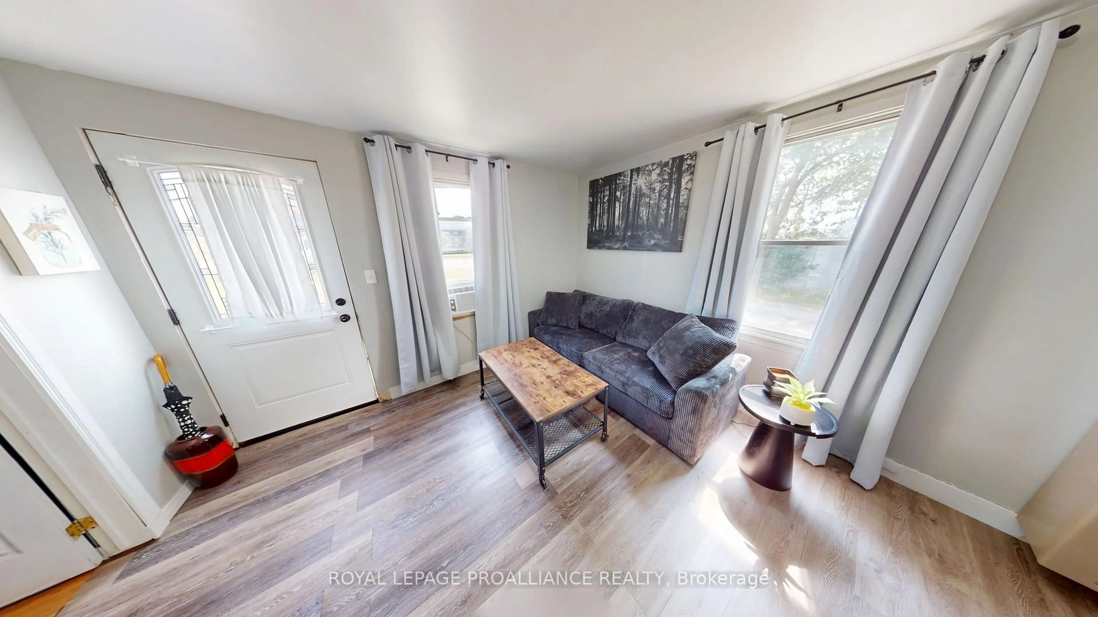 Living room with furniture, wood/laminate floor for 97 Aikins Rd, Belleville Ontario K8R 0A7