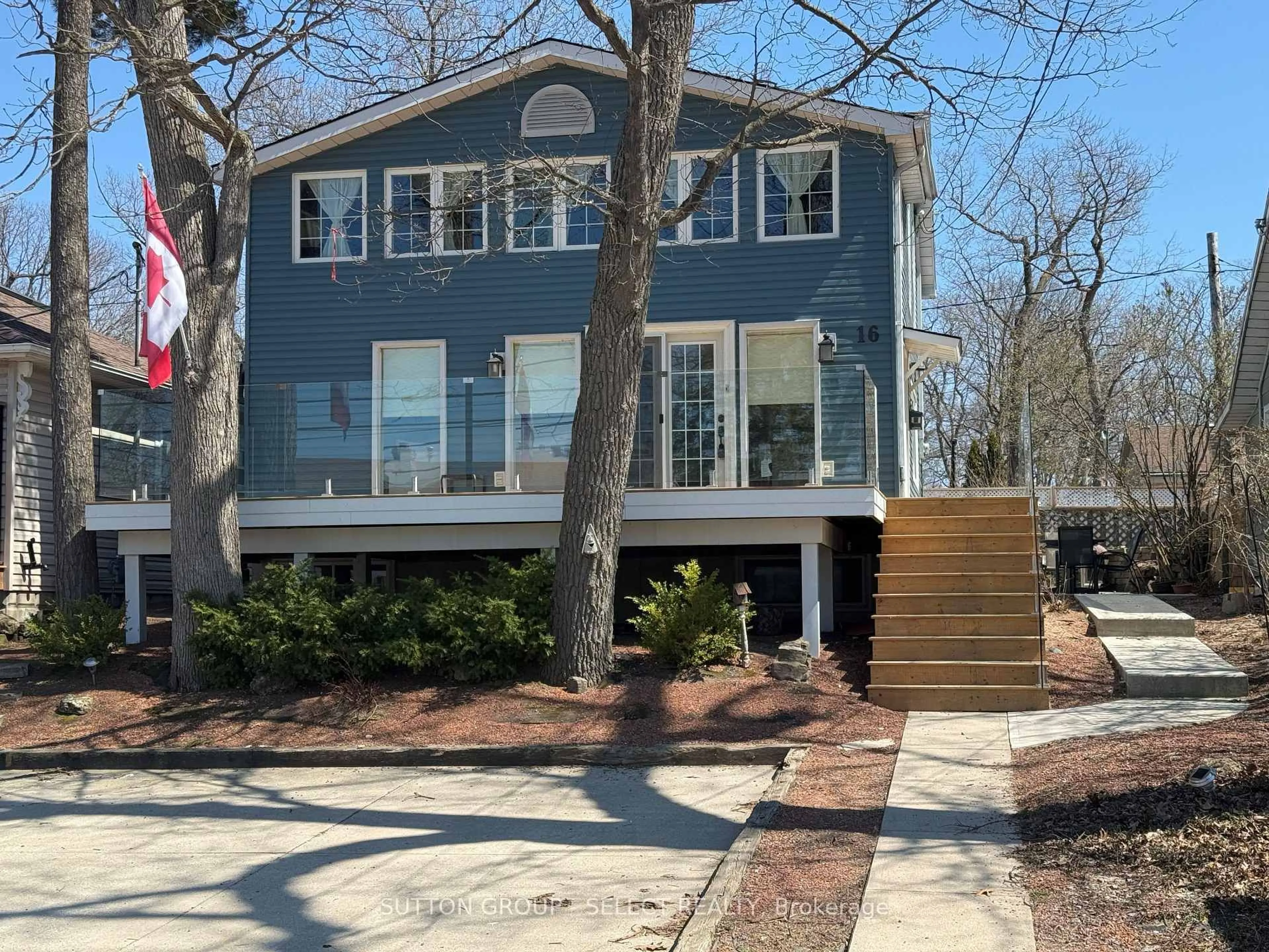Home with vinyl exterior material, street for 16 Huron Ave, Lambton Shores Ontario N0M 1T0