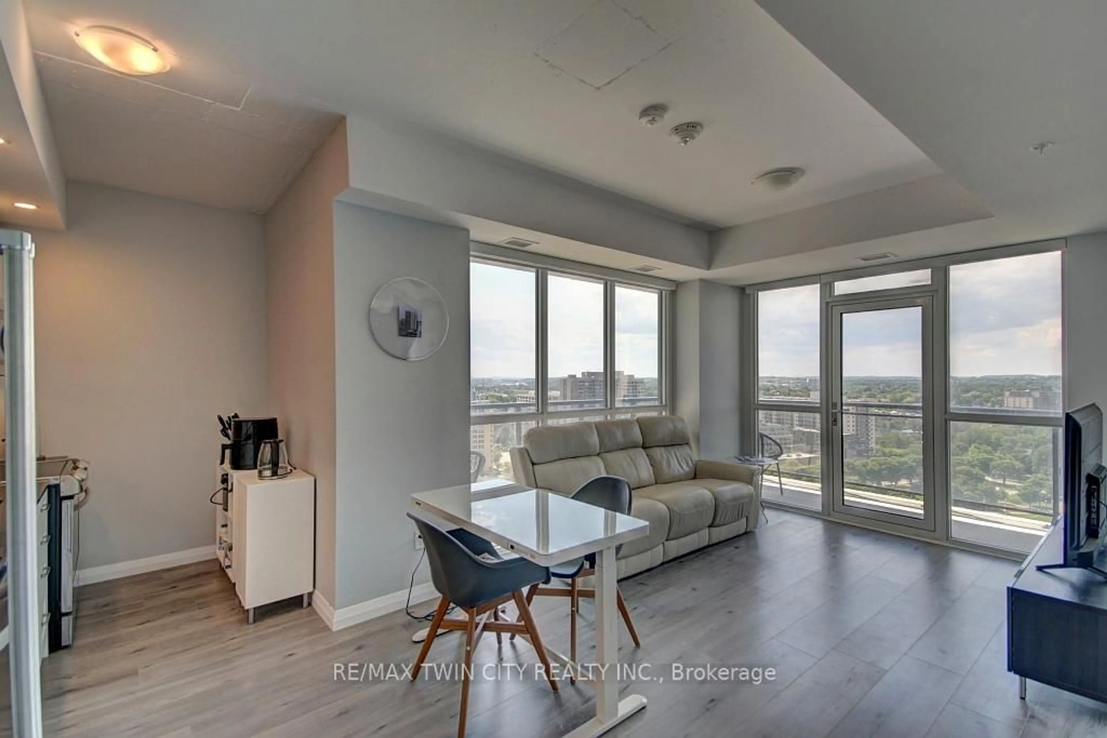 Living room with furniture, wood/laminate floor for 60 Charles St #1805, Kitchener Ontario N2G 0C9