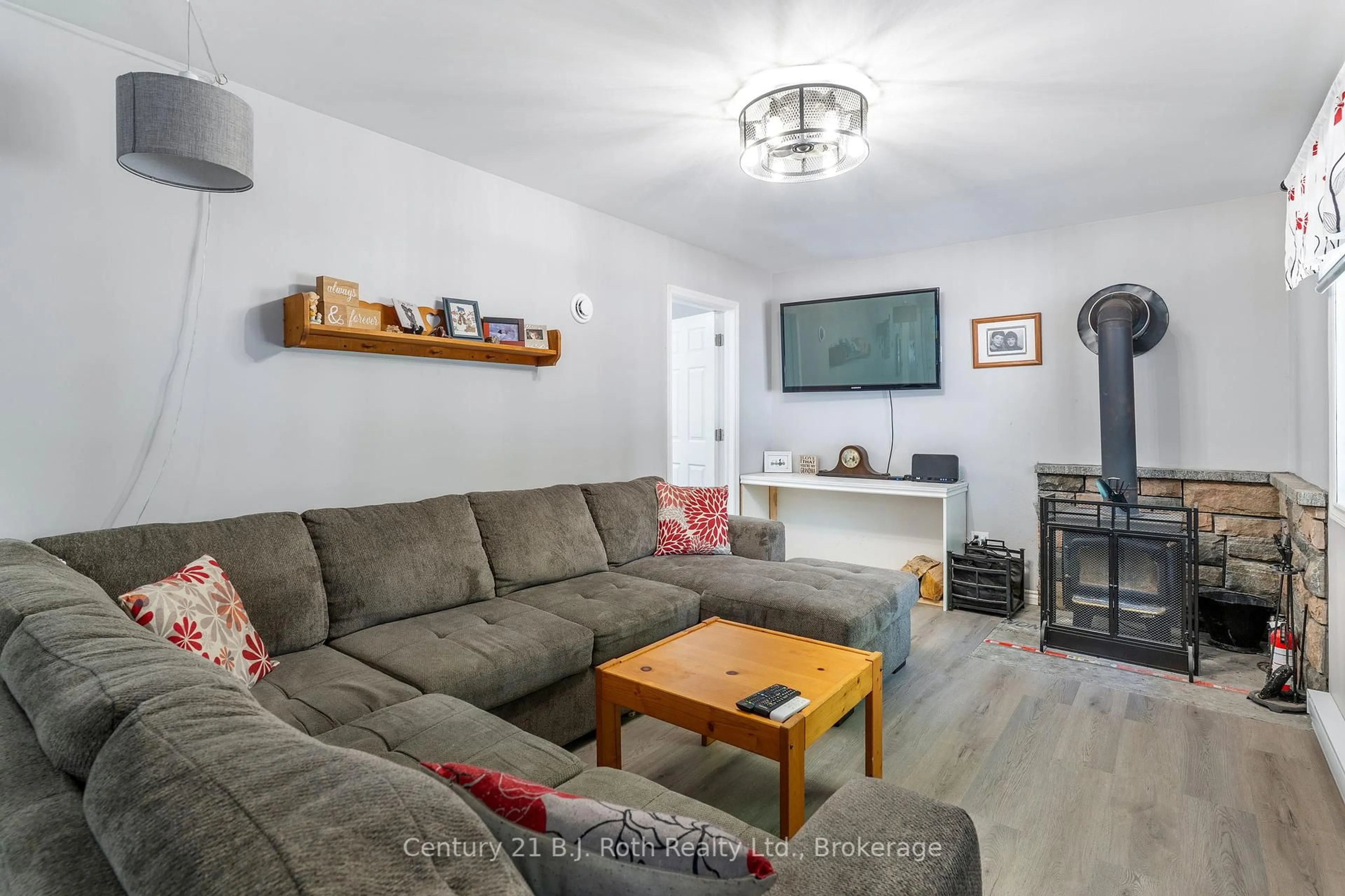 Living room with furniture, wood/laminate floor for 12664 Haliburton County Road 503, Highlands East Ontario K0L 2Y0