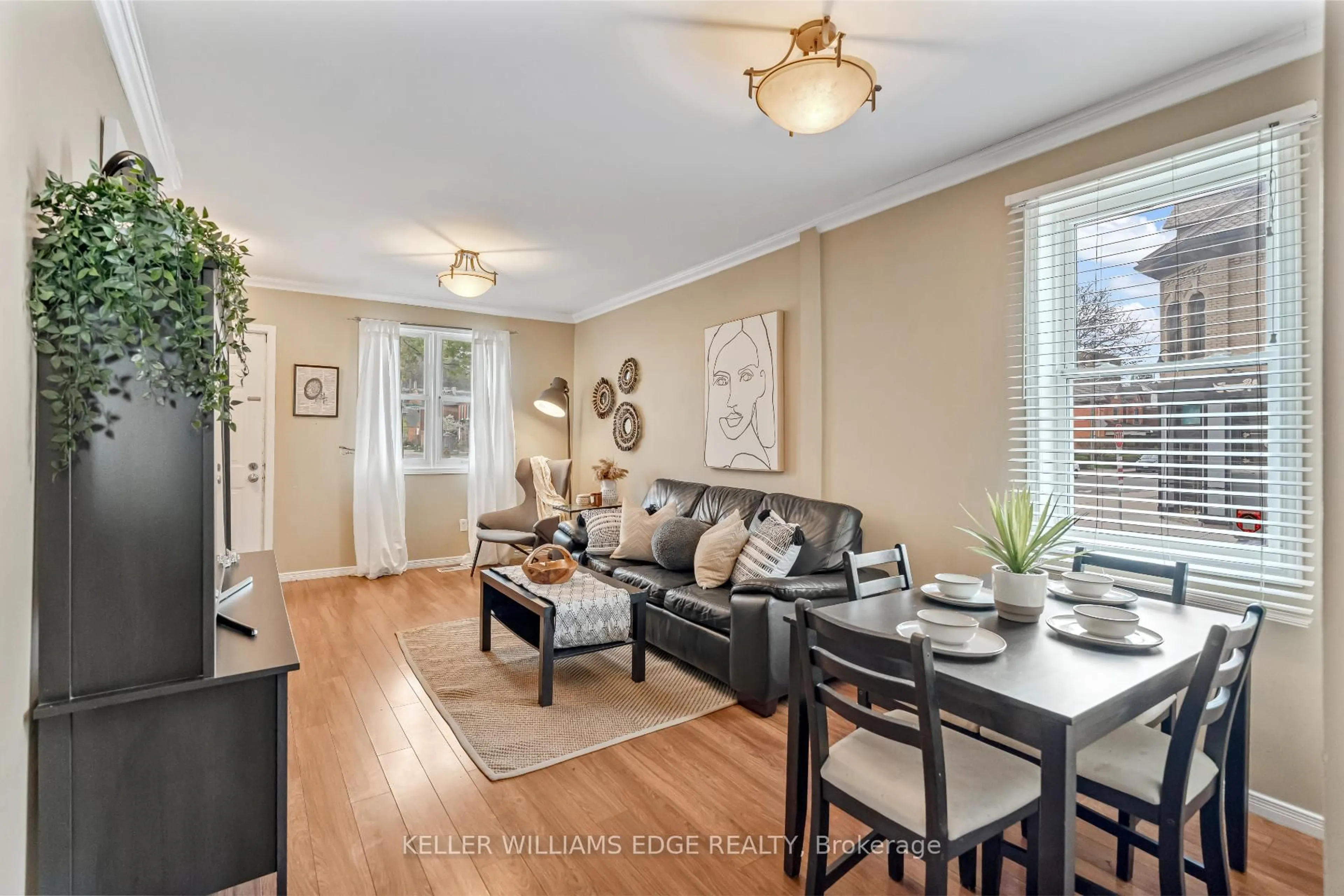 Living room with furniture, wood/laminate floor for 177 Young St, Hamilton Ontario L8N 1V9
