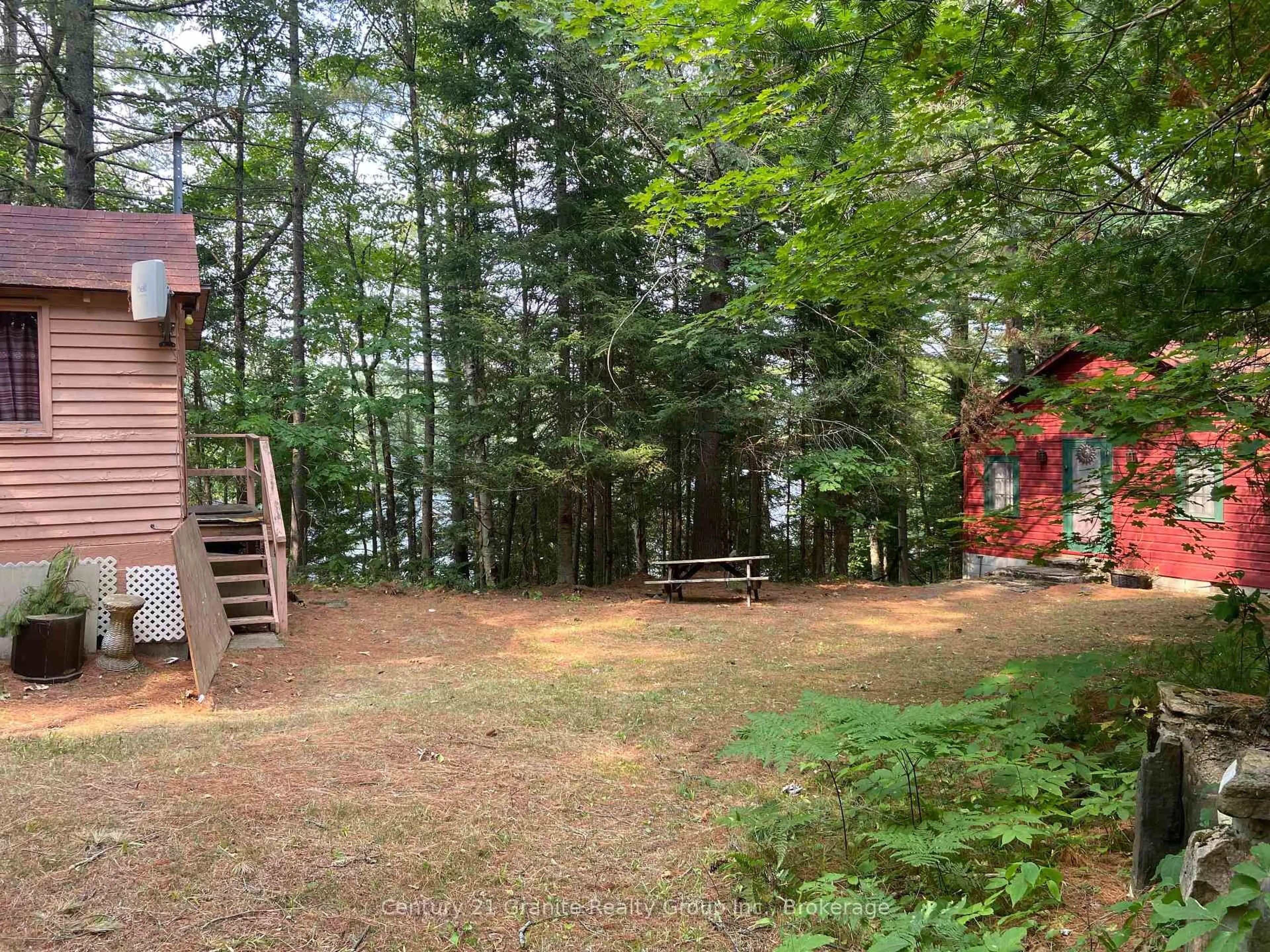 A pic from outside/outdoor area/front of a property/back of a property/a pic from drone, forest/trees view for 1035 Nawautin Lane, Minden Hills Ontario K0M 2K0