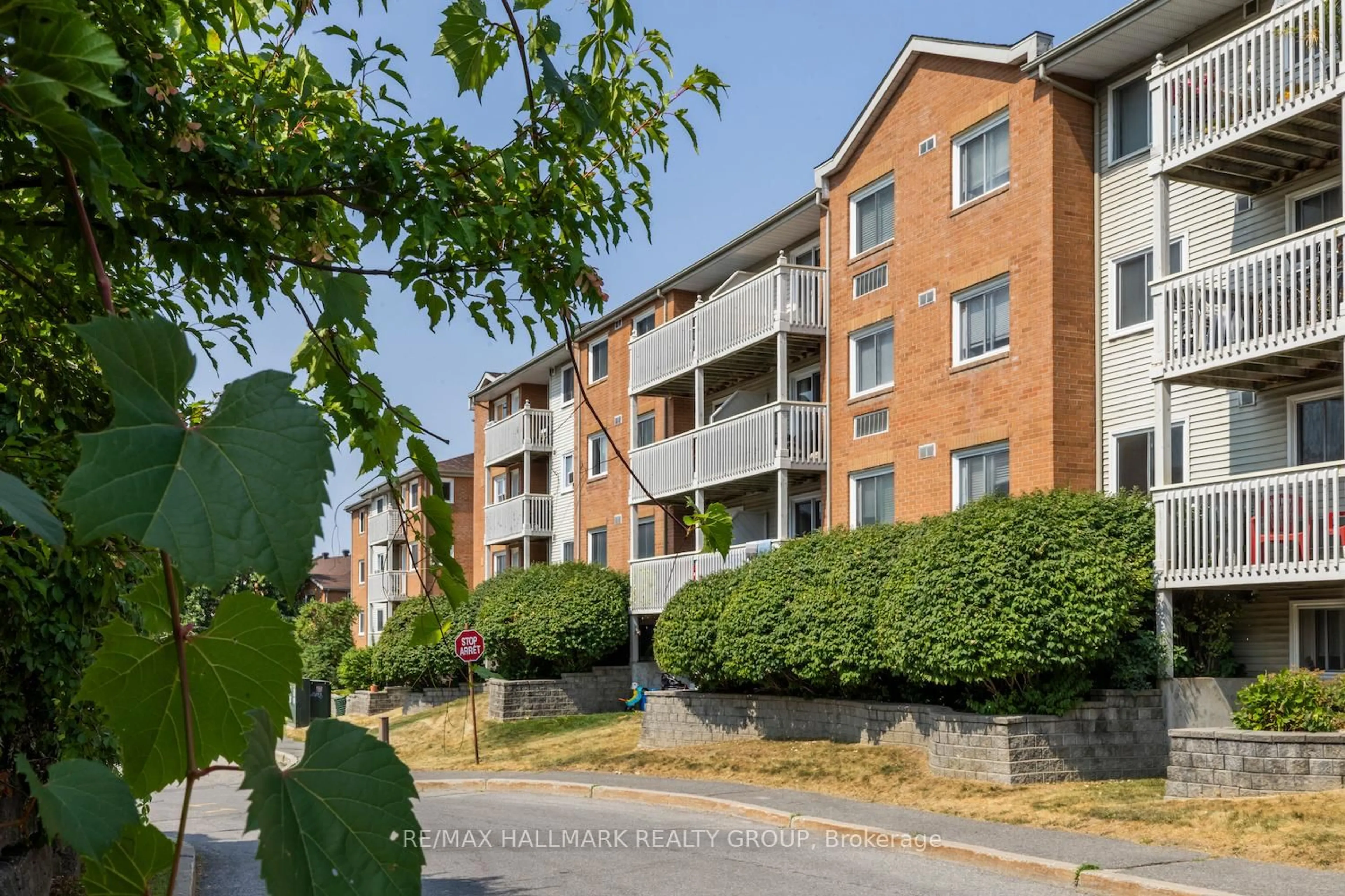 A pic from outside/outdoor area/front of a property/back of a property/a pic from drone, street for 345 Centrum Blvd #203, Ottawa Ontario K1E 3W9