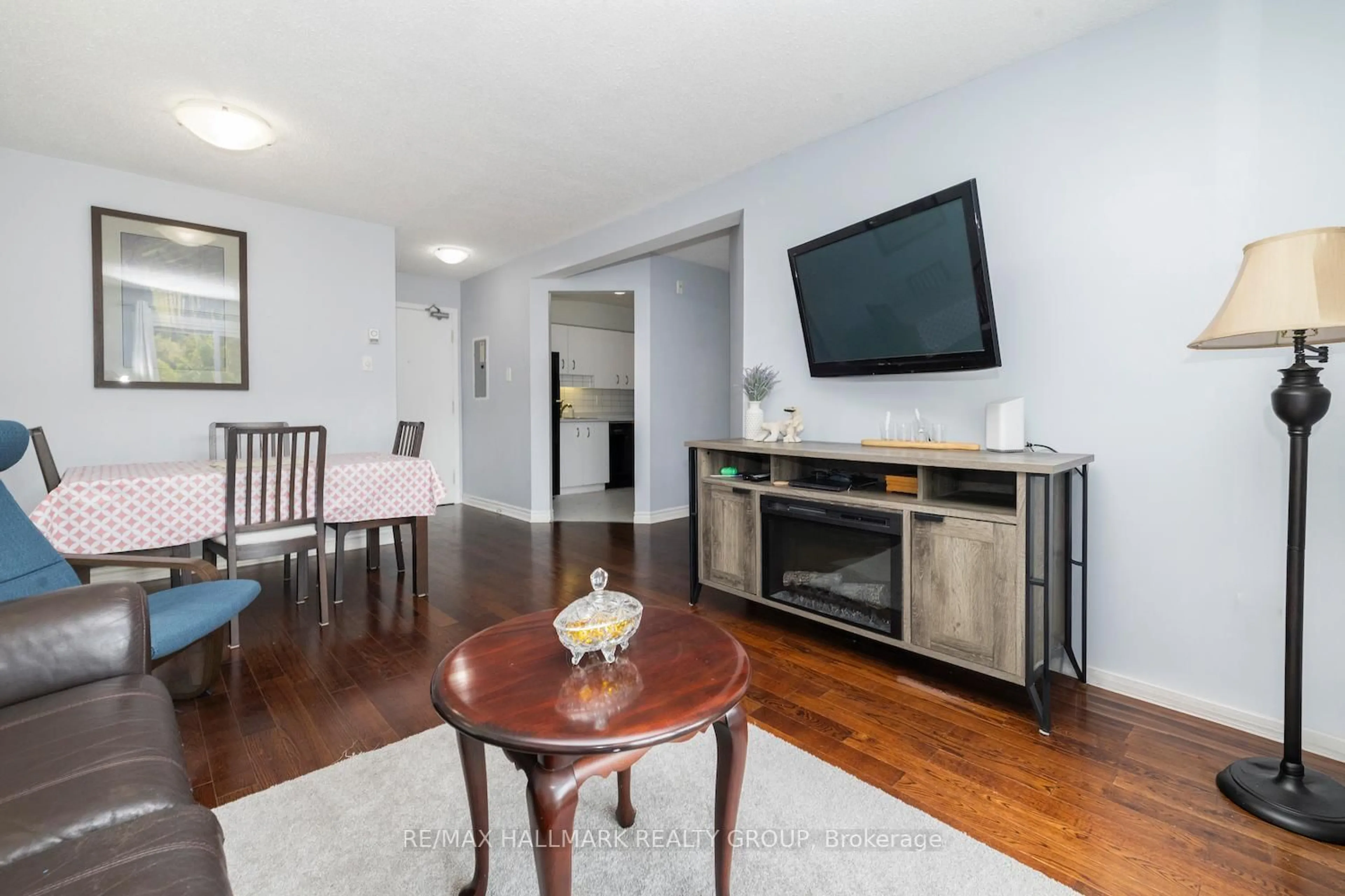 Living room with furniture, wood/laminate floor for 345 Centrum Blvd #203, Ottawa Ontario K1E 3W9