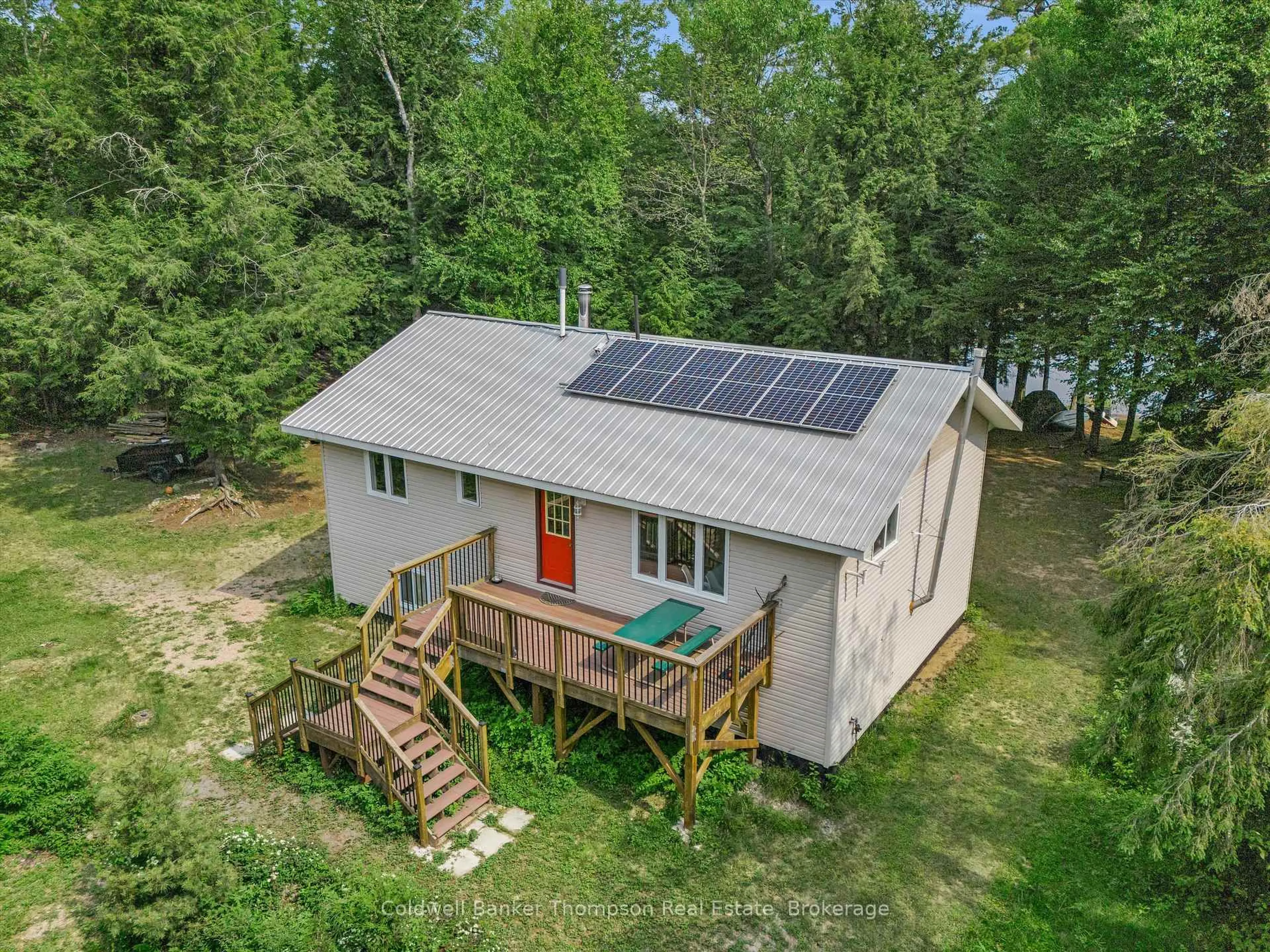 A pic from outside/outdoor area/front of a property/back of a property/a pic from drone, water/lake/river/ocean view for 439 A Baker Rd, Magnetawan Ontario P0A 1P0