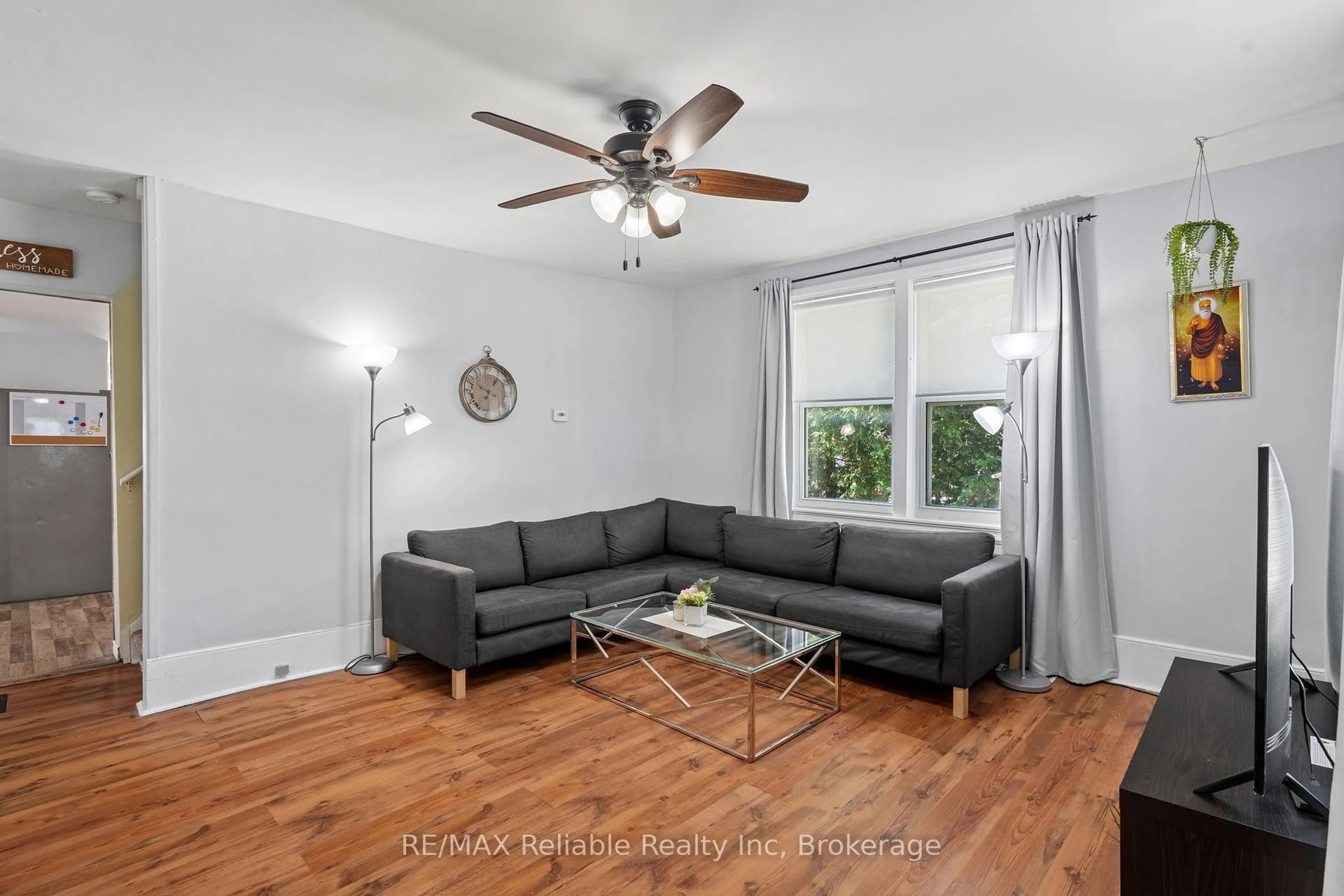 Living room with furniture, wood/laminate floor for 42 West William St, Huron East Ontario N0K 1W0