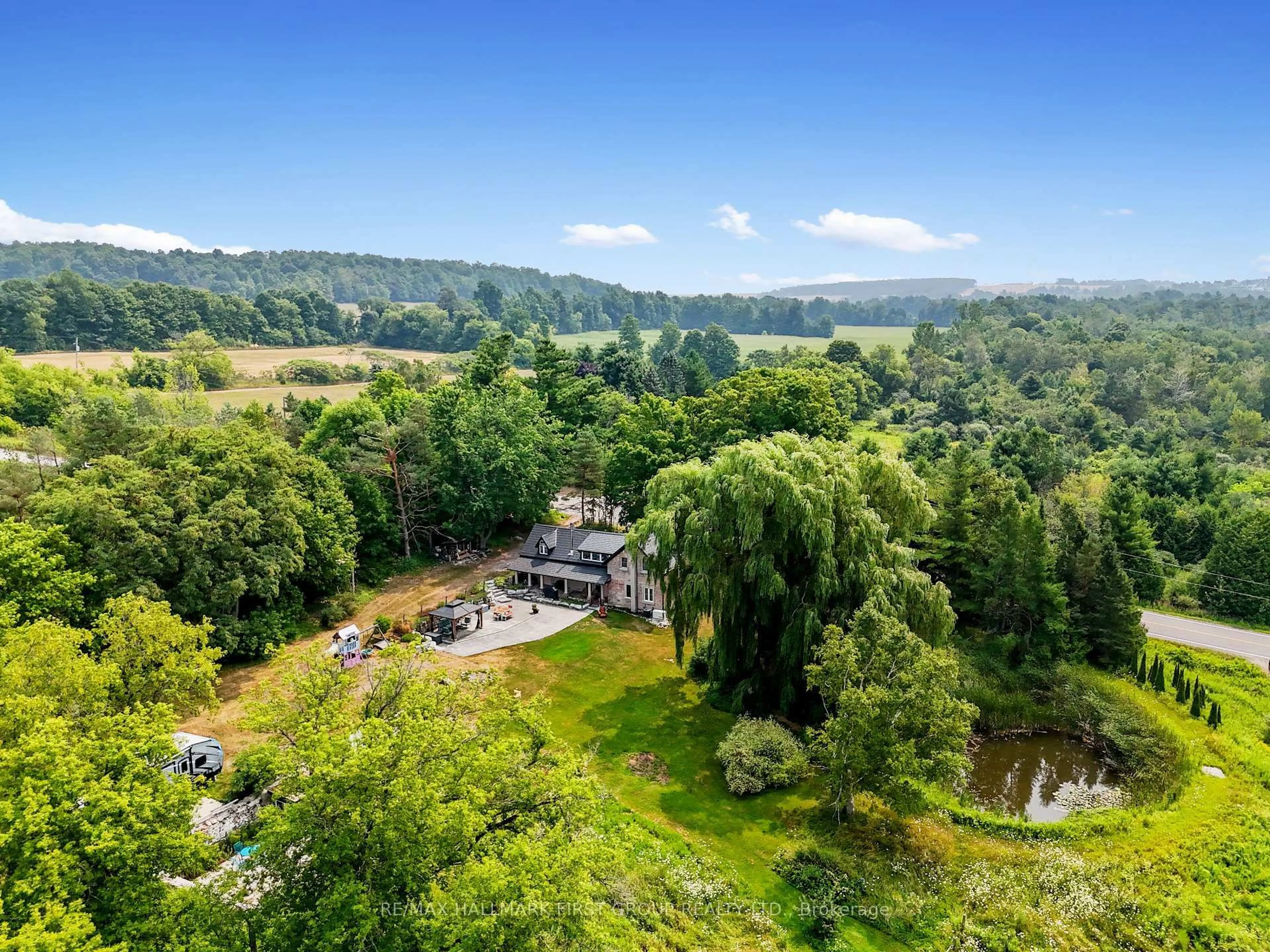 A pic from outside/outdoor area/front of a property/back of a property/a pic from drone, water/lake/river/ocean view for 13014 County 21 Rd, Cramahe Ontario K0K 1S0