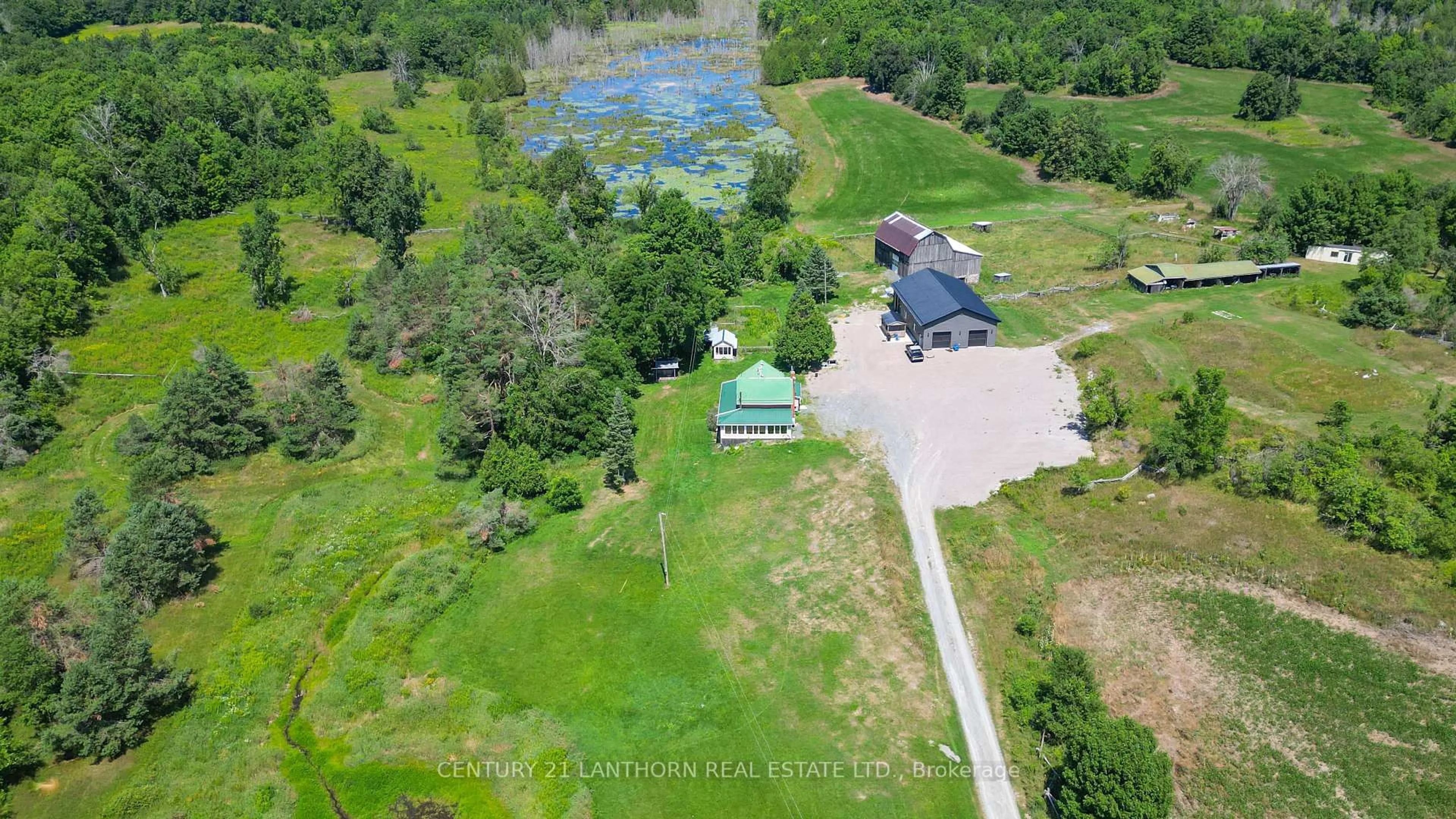 A pic from outside/outdoor area/front of a property/back of a property/a pic from drone, water/lake/river/ocean view for 495 Barker Rd, Madoc Ontario K0K 2K0
