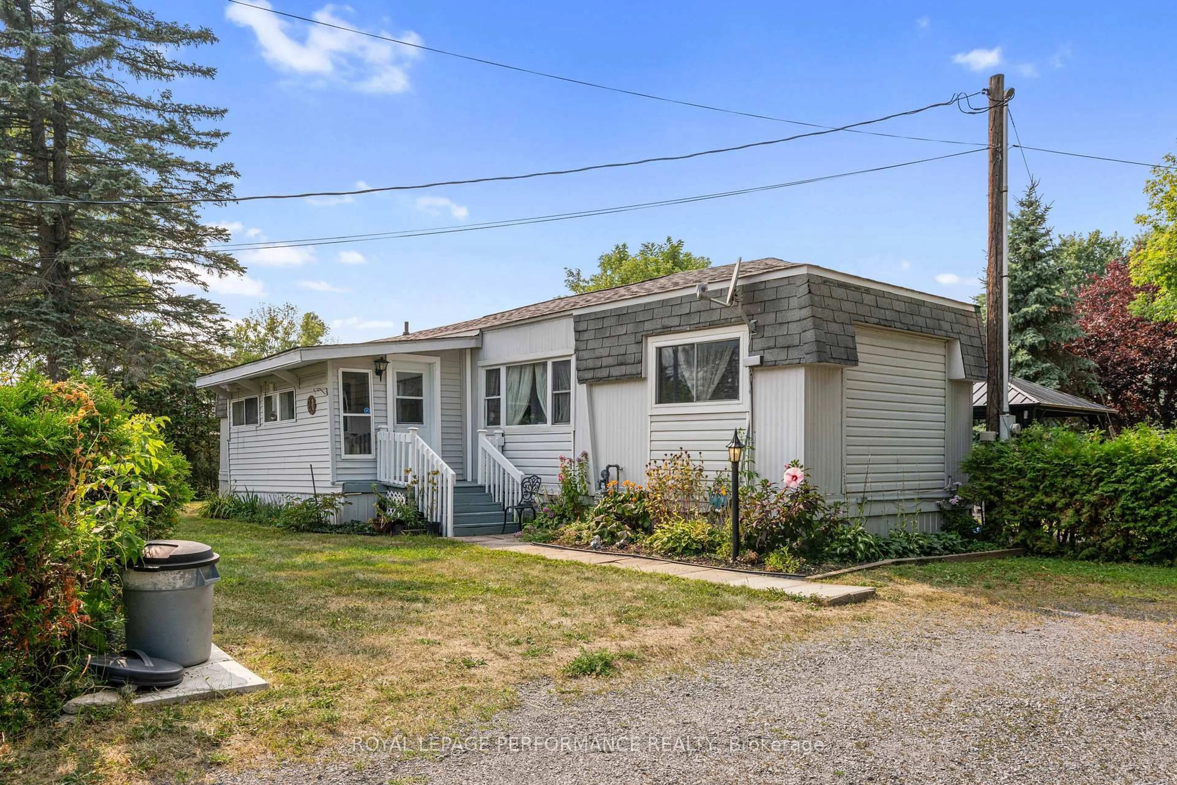 Home with vinyl exterior material, street for 21 Thomas St, South Glengarry Ontario K0C 1N0