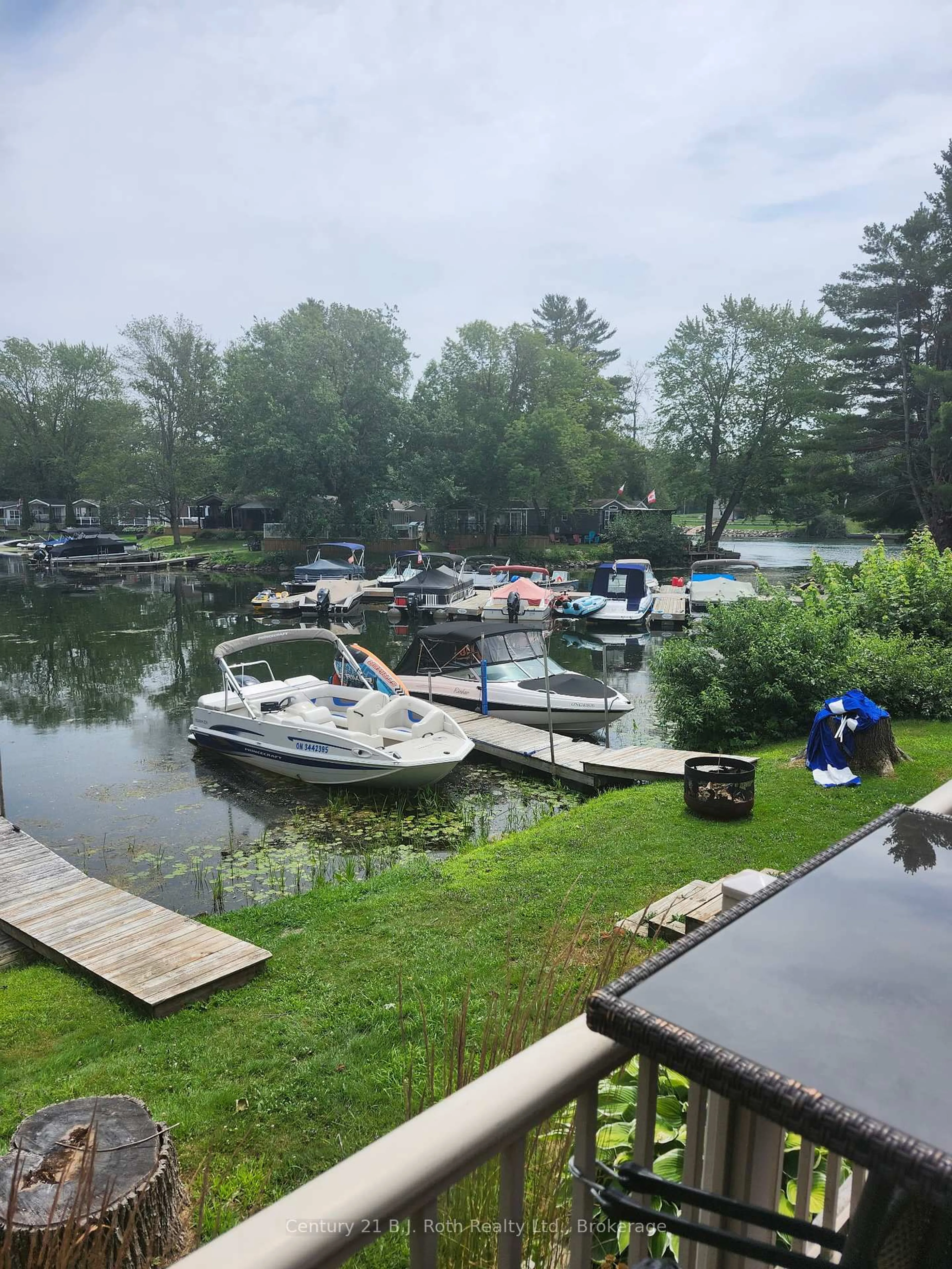 A pic from outside/outdoor area/front of a property/back of a property/a pic from drone, water/lake/river/ocean view for 1082 Shamrock Marina Rd #32, Gravenhurst Ontario P0E 1N0
