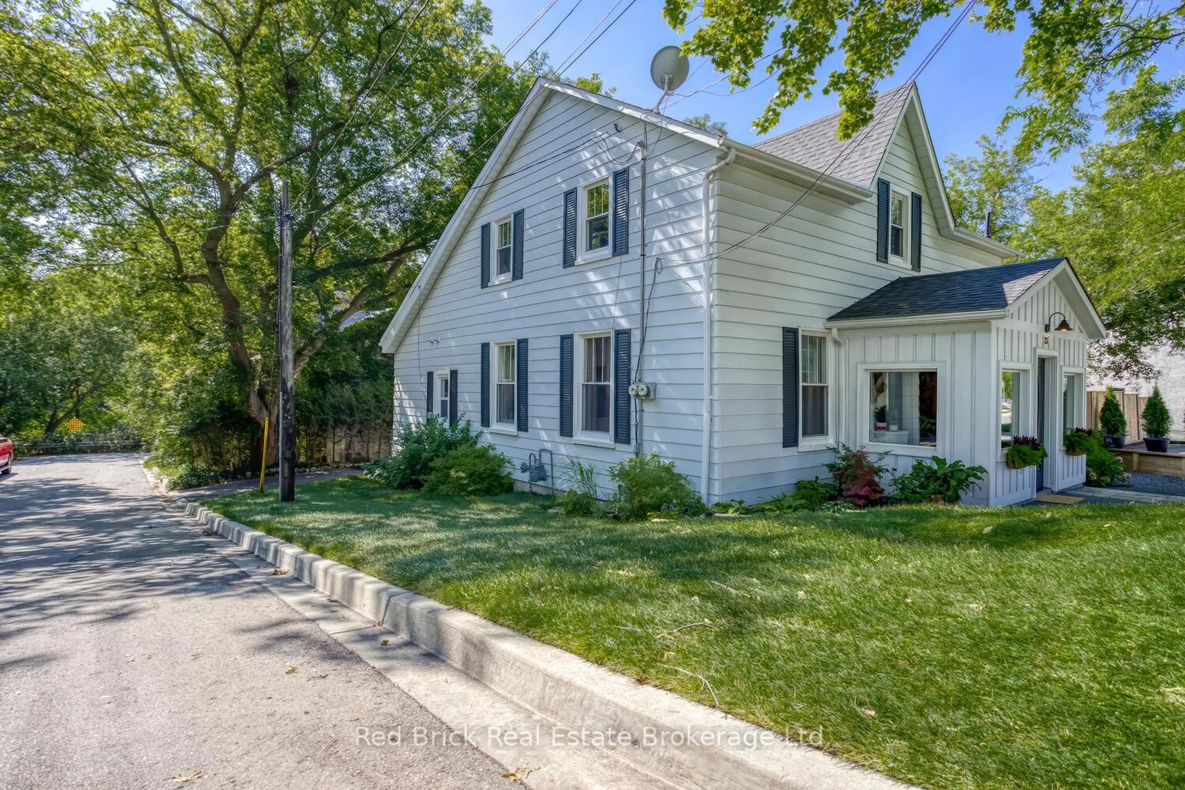 Home with vinyl exterior material, street for 23 Mill St, Centre Wellington Ontario N0B 1S0