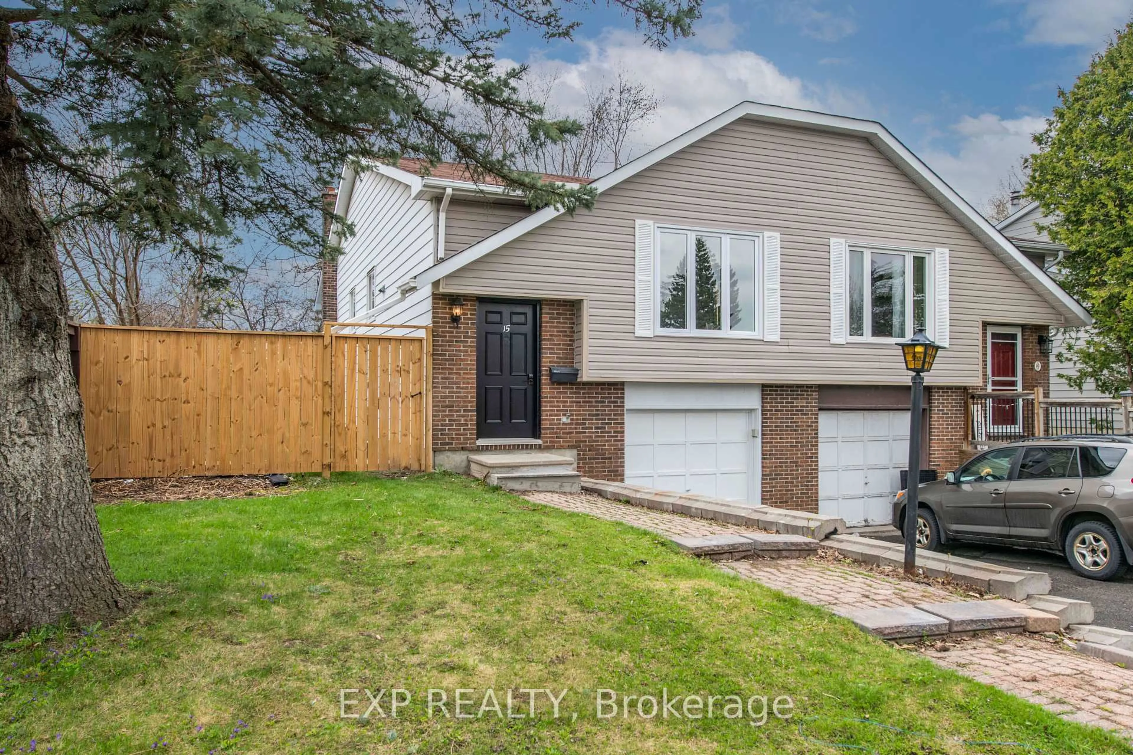 Home with vinyl exterior material, street for 15 Kadeer Way, Ottawa Ontario K2J 1J6
