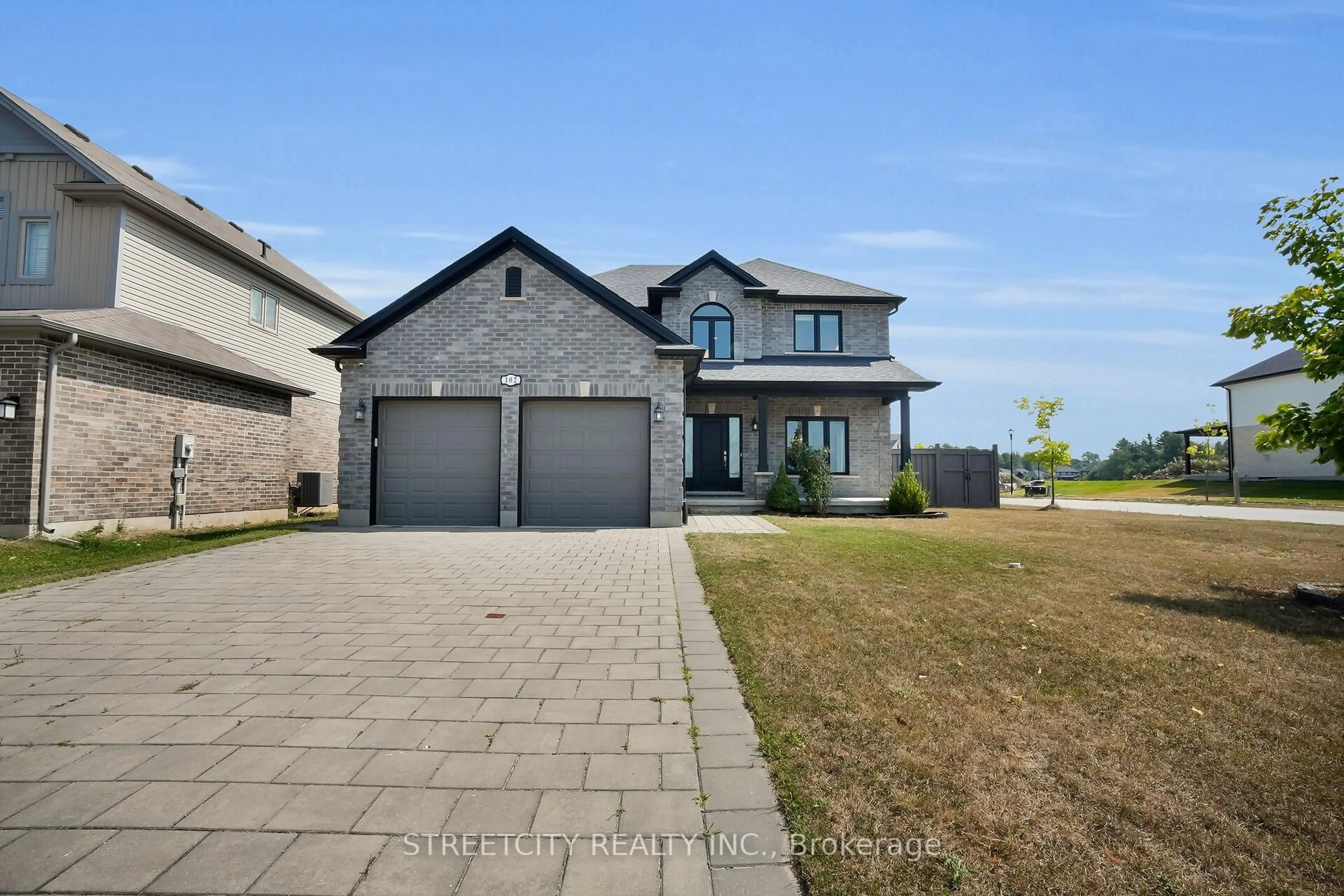 Home with brick exterior material, street for 102 Timberwalk Tr, Middlesex Centre Ontario N0M 2A0