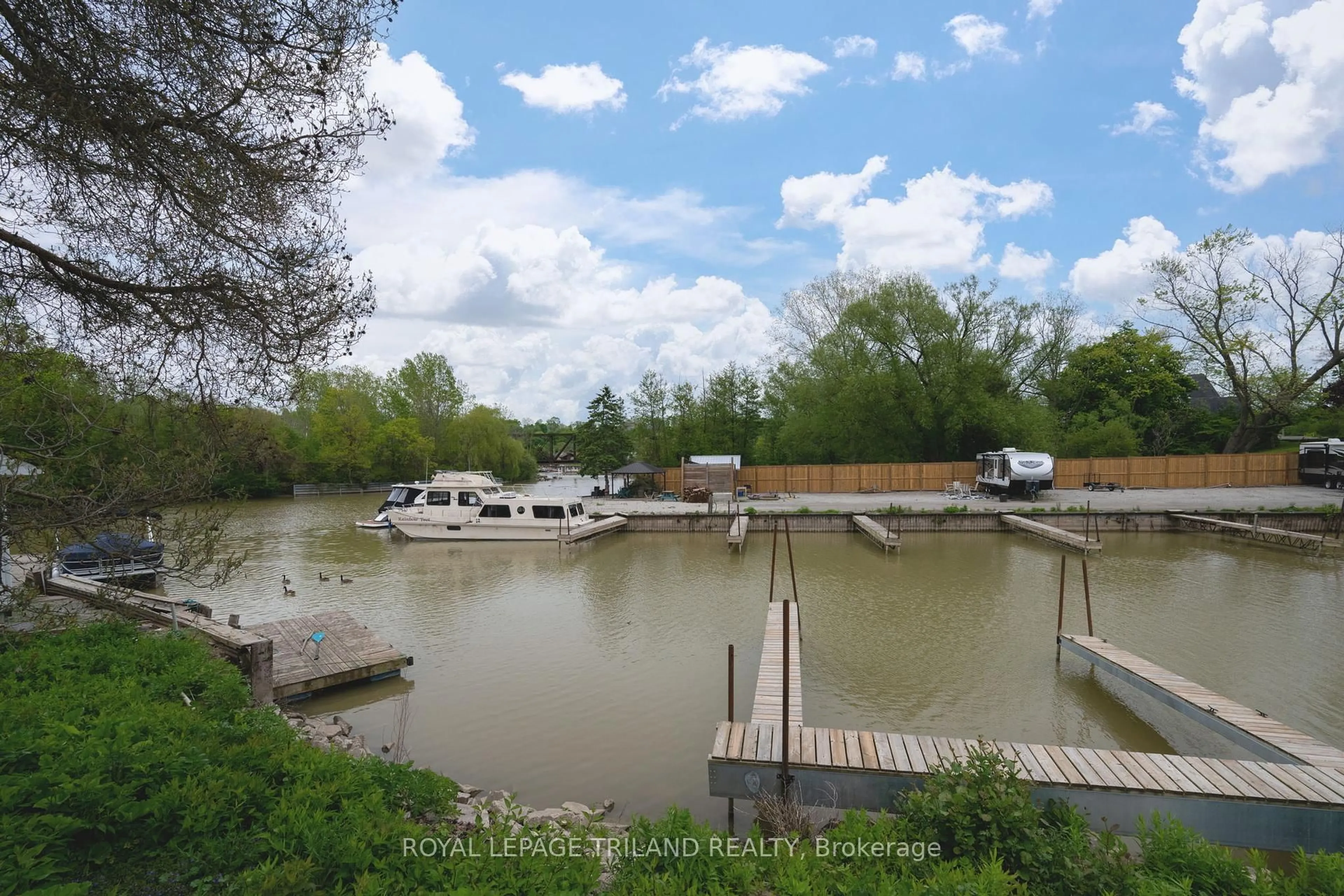 A pic from outside/outdoor area/front of a property/back of a property/a pic from drone, water/lake/river/ocean view for 301 Carlow Rd #36, Central Elgin Ontario N5L 1B8