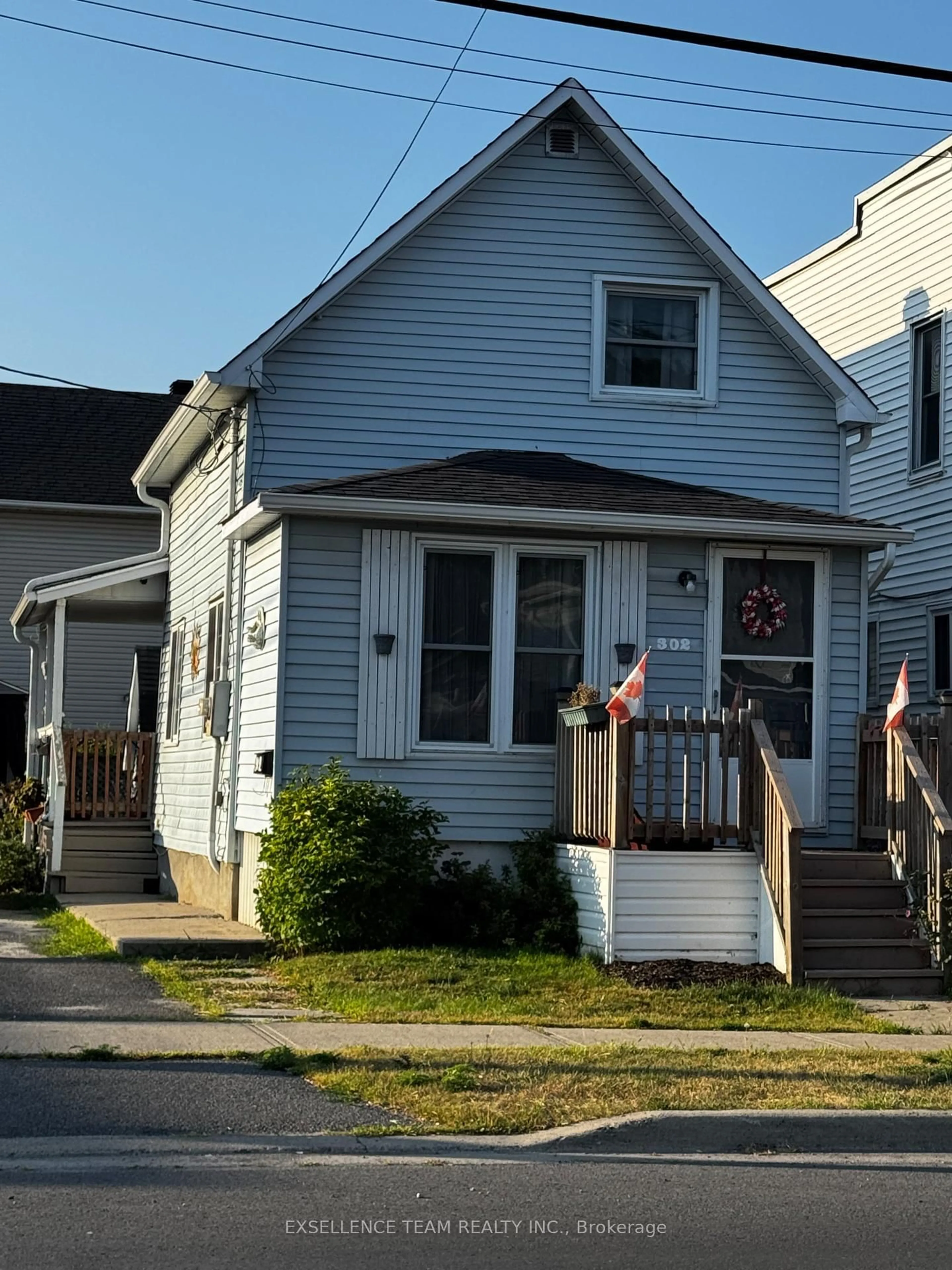 Home with vinyl exterior material, street for 302 Seventh St, Cornwall Ontario K6J 2Y5