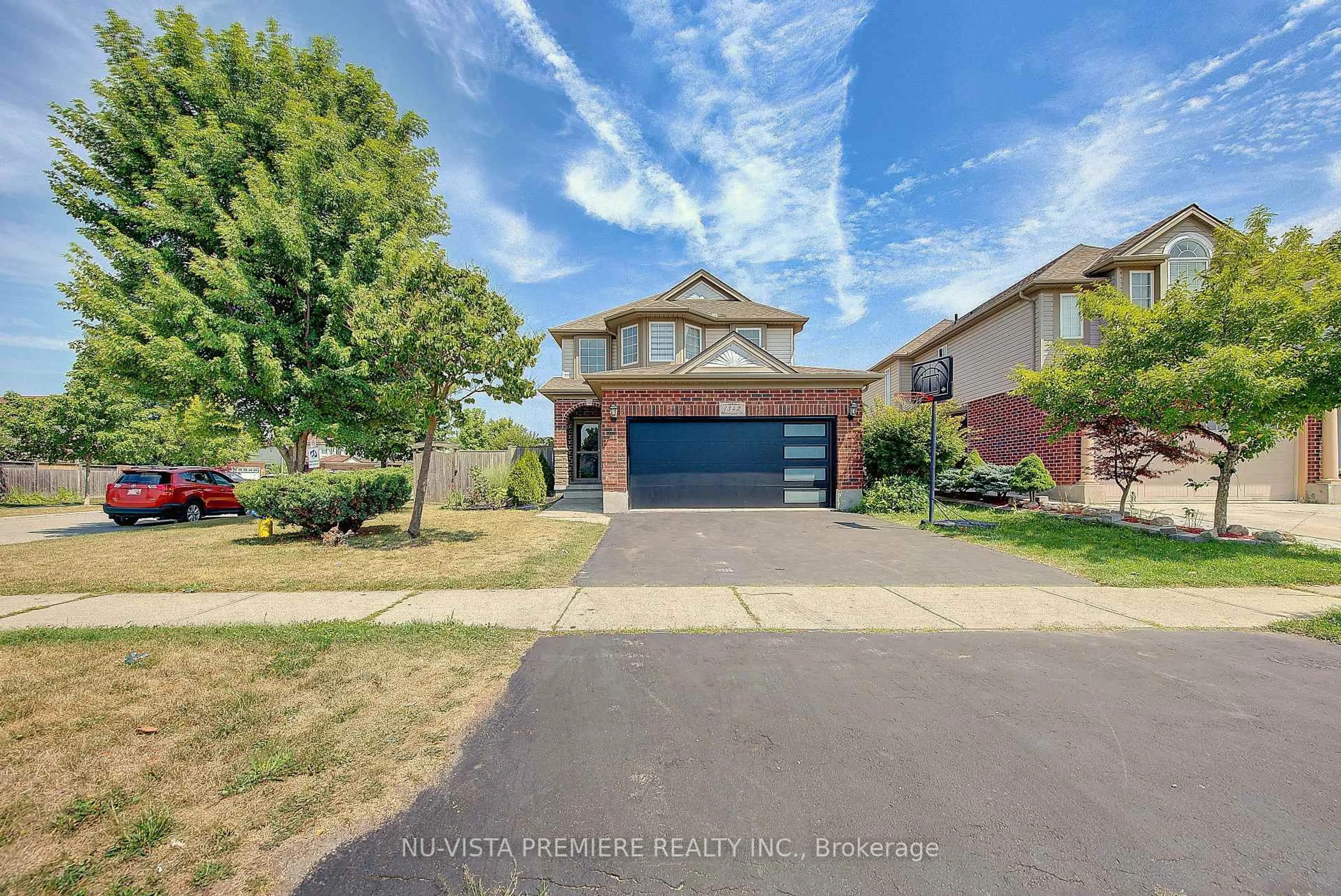 A pic from outside/outdoor area/front of a property/back of a property/a pic from drone, street for 1342 Blackmaple Dr, London East Ontario N5Y 6K9